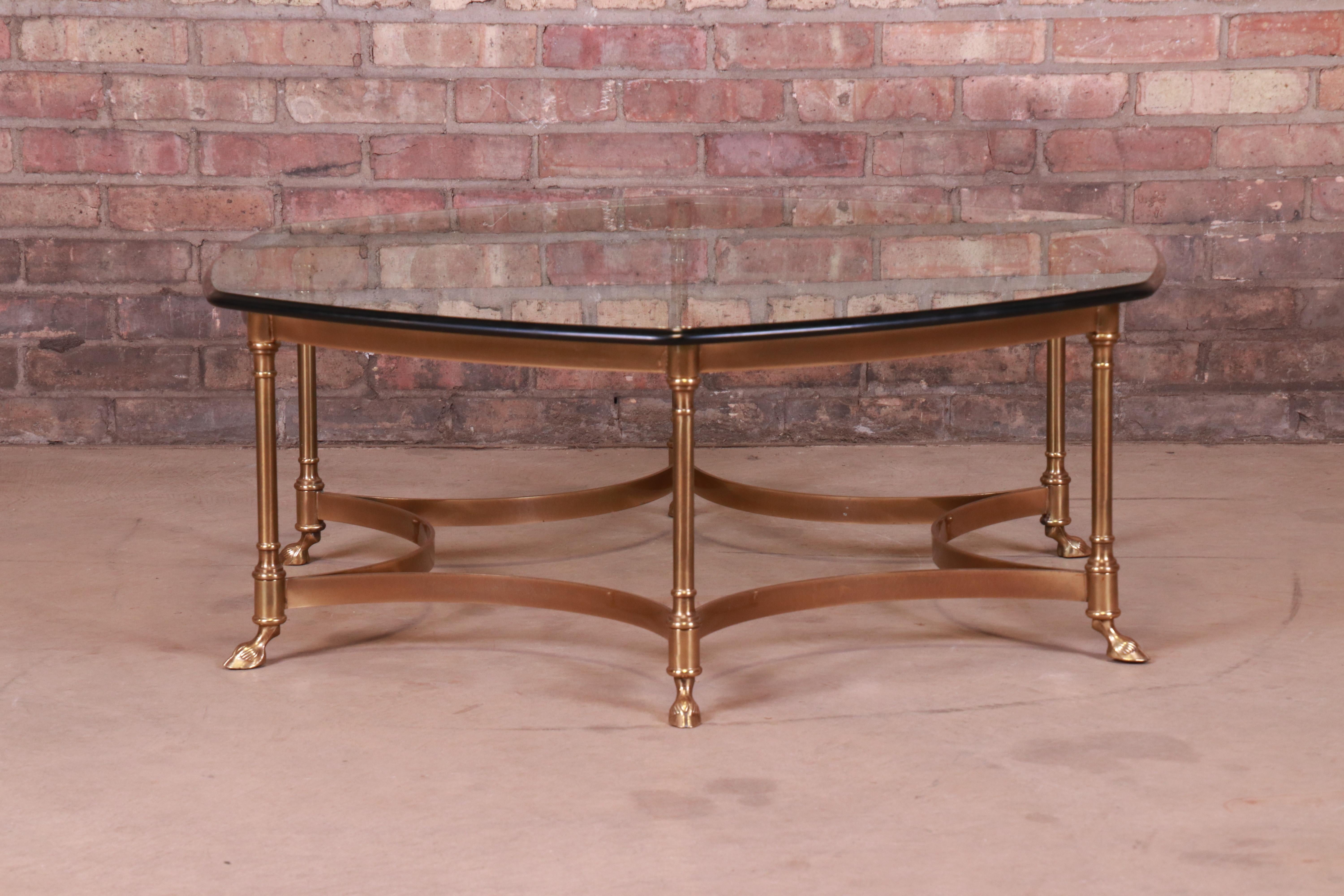 A gorgeous Mid-Century Modern Hollywood Regency hexagonal hooved feet coffee or cocktail table

By Labarge,

circa 1960s

Solid brass frame, with beveled glass top.

Measures: 42