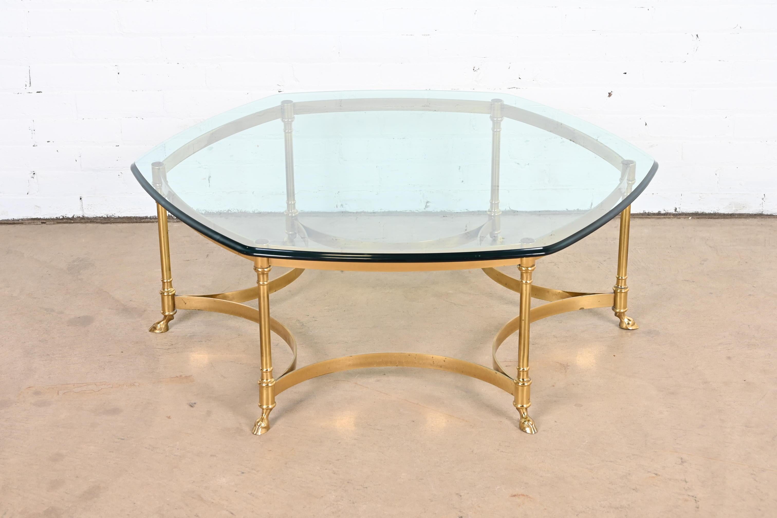 A gorgeous Mid-Century Modern Hollywood Regency hexagonal hooved feet coffee or cocktail table

By Labarge

Circa 1960s

Solid brass frame, with beveled glass top.

Measures: 42.5