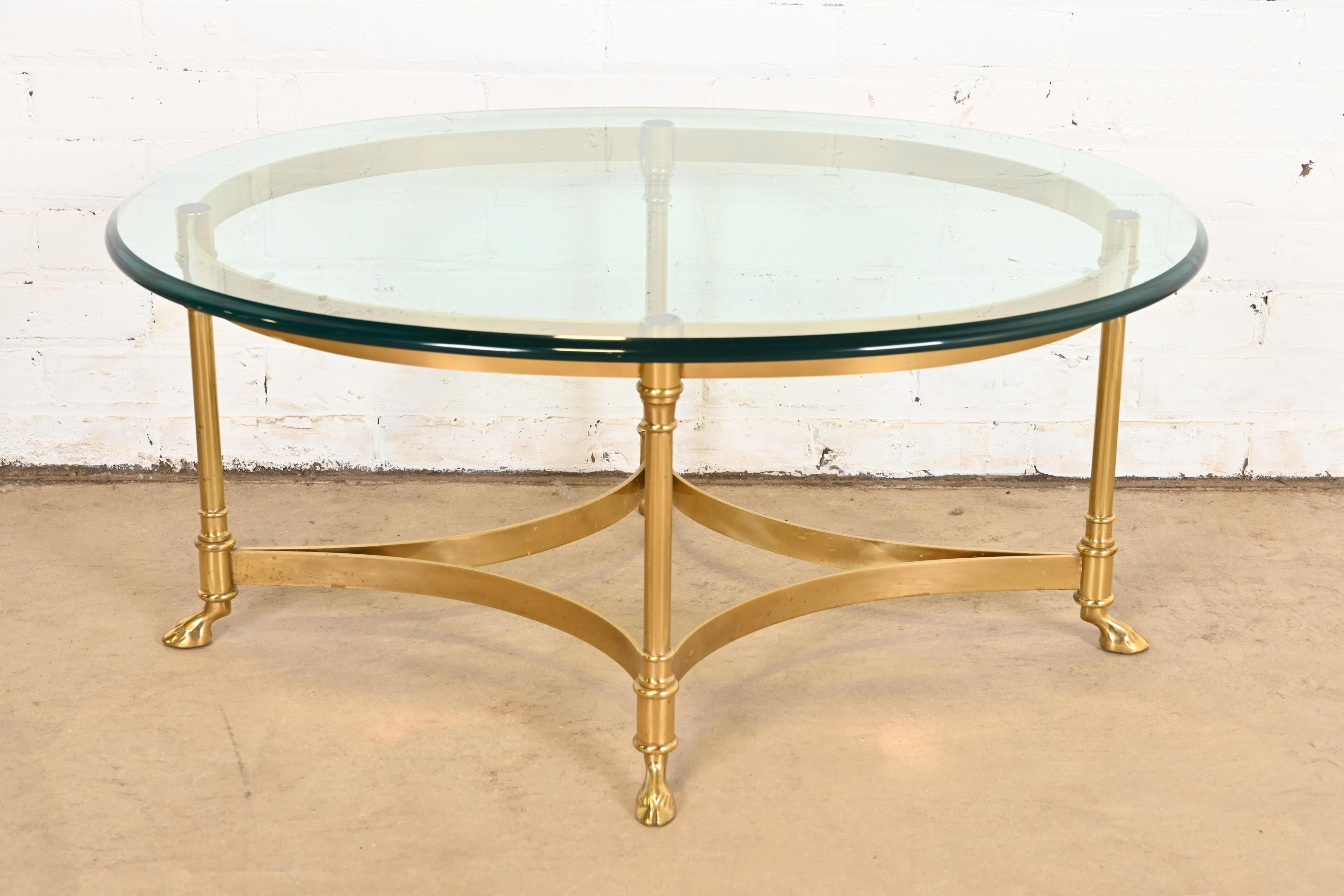 A gorgeous Mid-Century Modern Hollywood Regency brass and glass hooved feet coffee or cocktail table

By Labarge

Circa 1960s

Solid brass base, with beveled glass top.

Measures: 34.25
