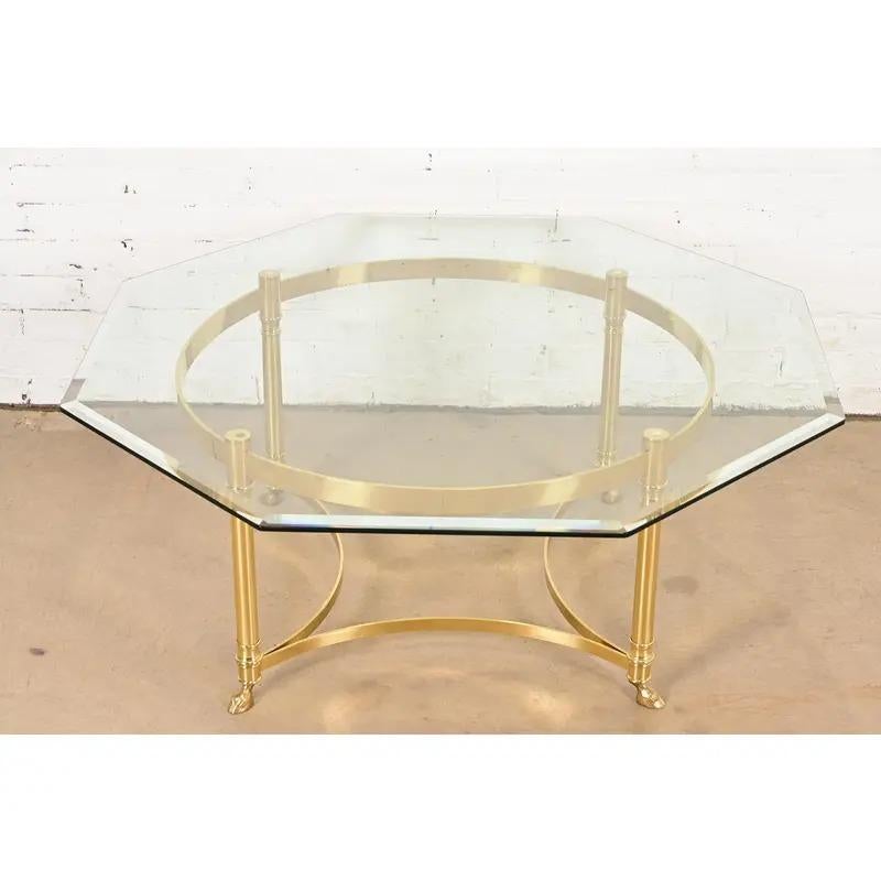 A gorgeous mid-century modern Hollywood Regency octagonal coffee table or cocktail table

By Labarge

USA, Circa 1960s

Solid brass frame, with beveled glass top.

Measures: 41.75
