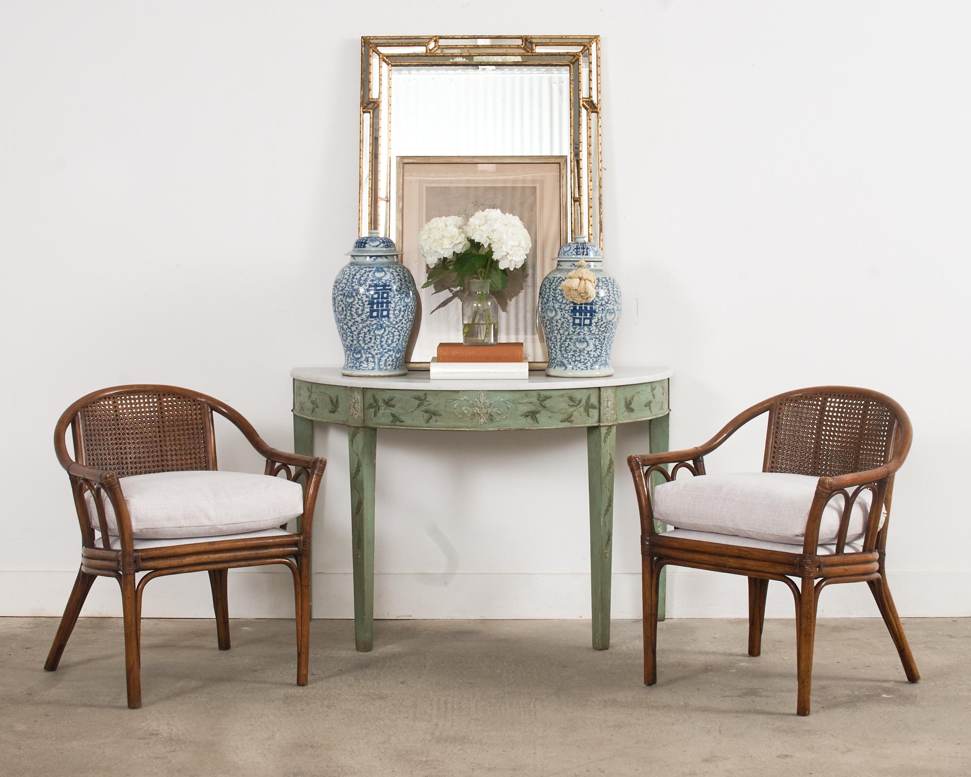 Opulent 20th century Italian Labarge cushion wall or mantle mirror in a rectangular shape. The mirror features a giltwood faux bamboo decorated frame with intricate mirror glass facets to catch the light at different angles. The giltwood has an