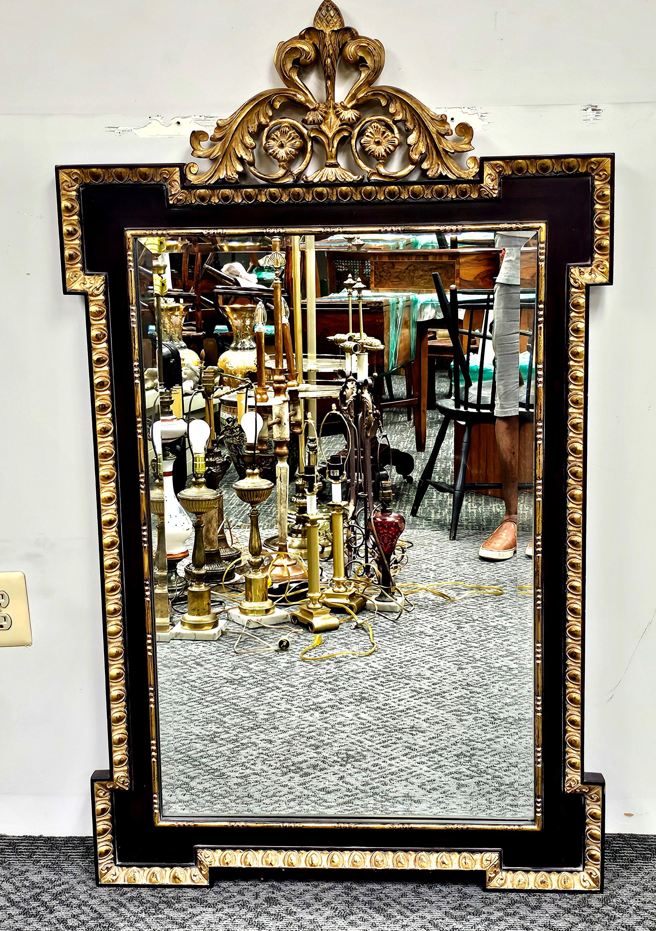 Miroir de style Napoléon III, doré à la patiente et ébonisé
Mesure 32,5
