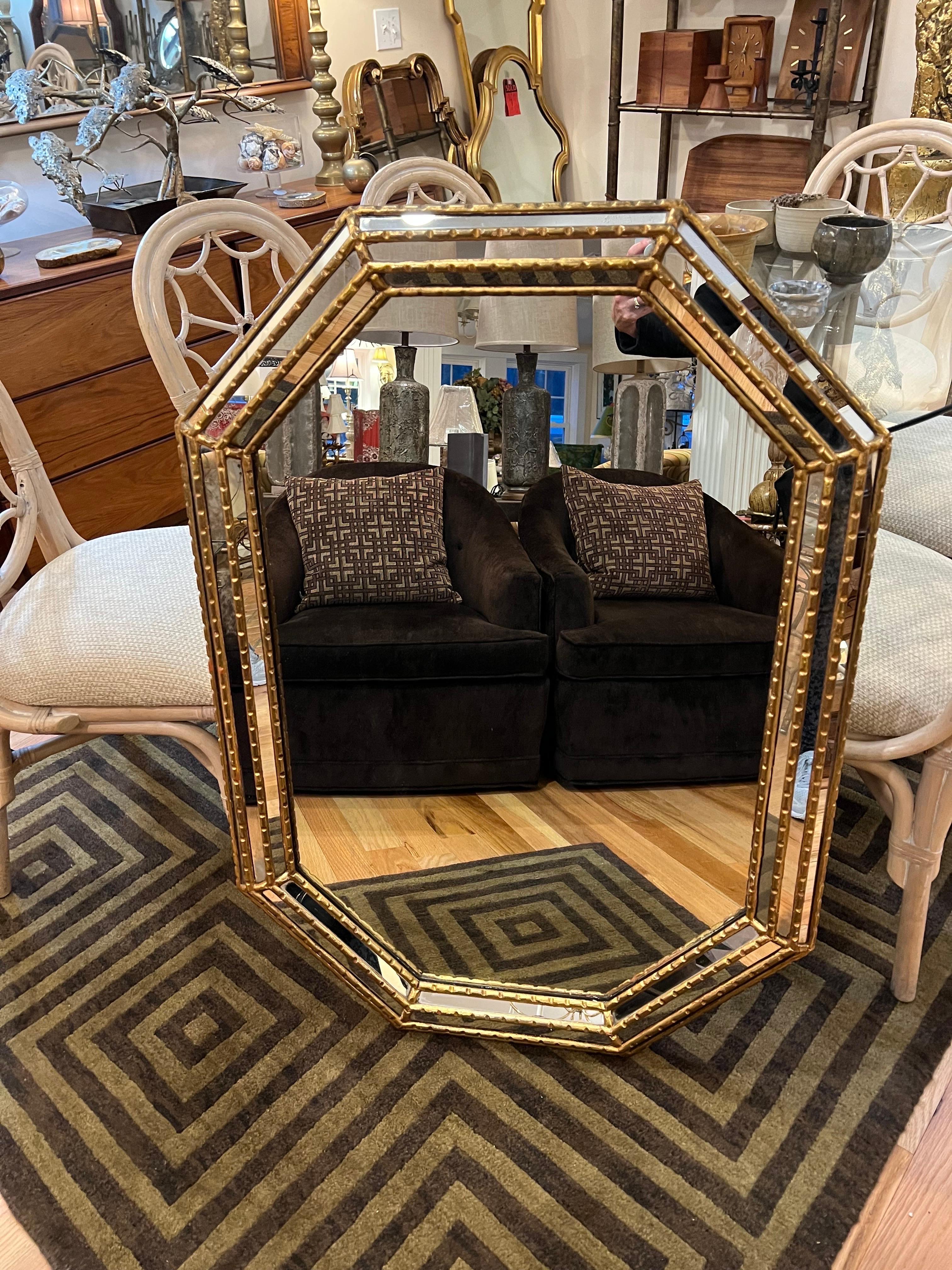 LaBarge Octagonal Gilt Mirror. Thick triple Beveled edges and wide frame make up this beauty. Interesting Octagonal shape . Perfect for a hallway or above a vanity.Solid wood and very well made piece. Signed on back with LaBarge Label.