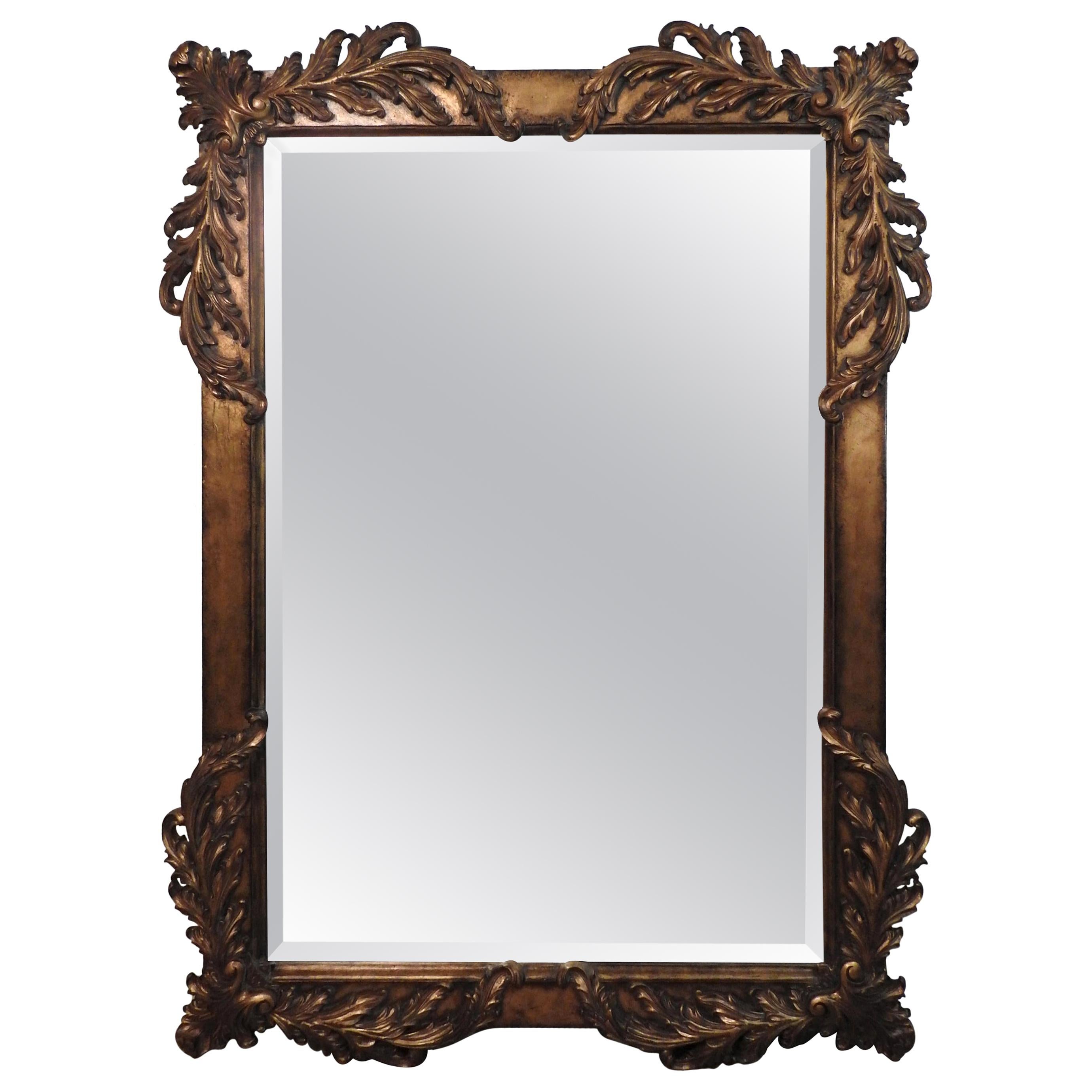 Offering this large Labarge mirror in the style of Rococo. Large mirror with a gilded frame and foliate detail on all four corners. Scales beautifully for a mantel or over a large chest.