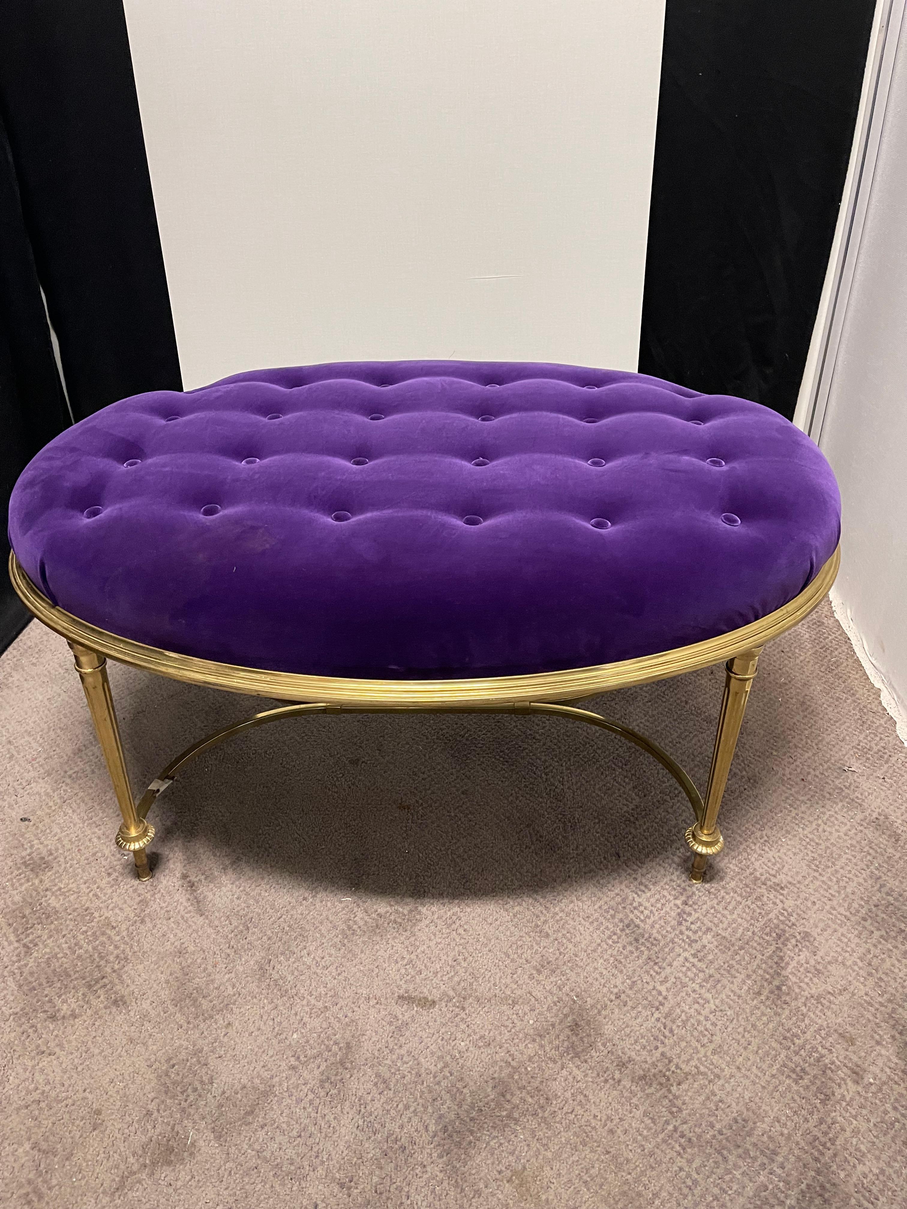 High quality solid brass bench with purple velvet upholstery.  Bench was recently upholstered with a tufted velvet top.  Made in the 1970s in the USA and sold by LaBarge. Excellent vintage condition.