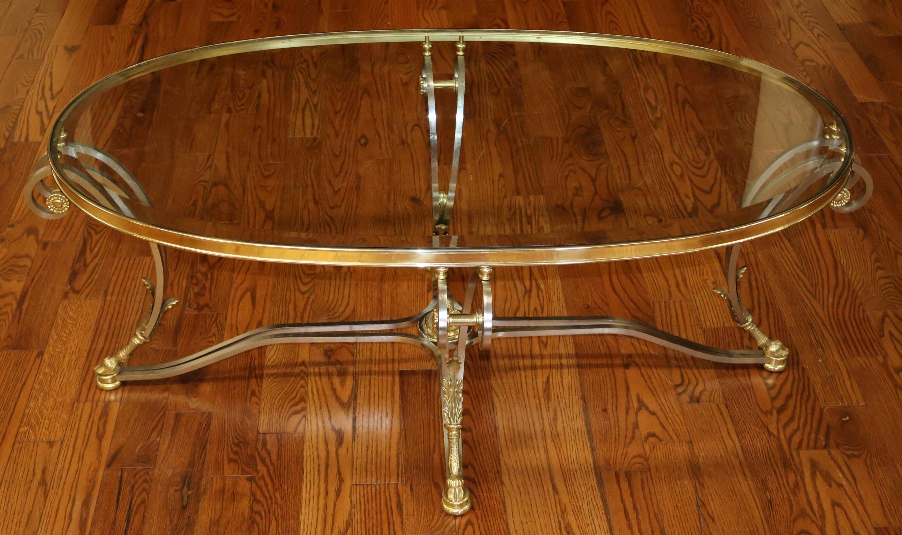 Labarge Steel And Brass Hollywood Regency Jansen Style Glass Top Table

Dimensions : 53.75ʺW × 32.5ʺD × 20.5ʺH

This gorgeous Hollywood regency coffee table was made by Labarge in the Hollywood regency style and has a stunning form! The coffee table
