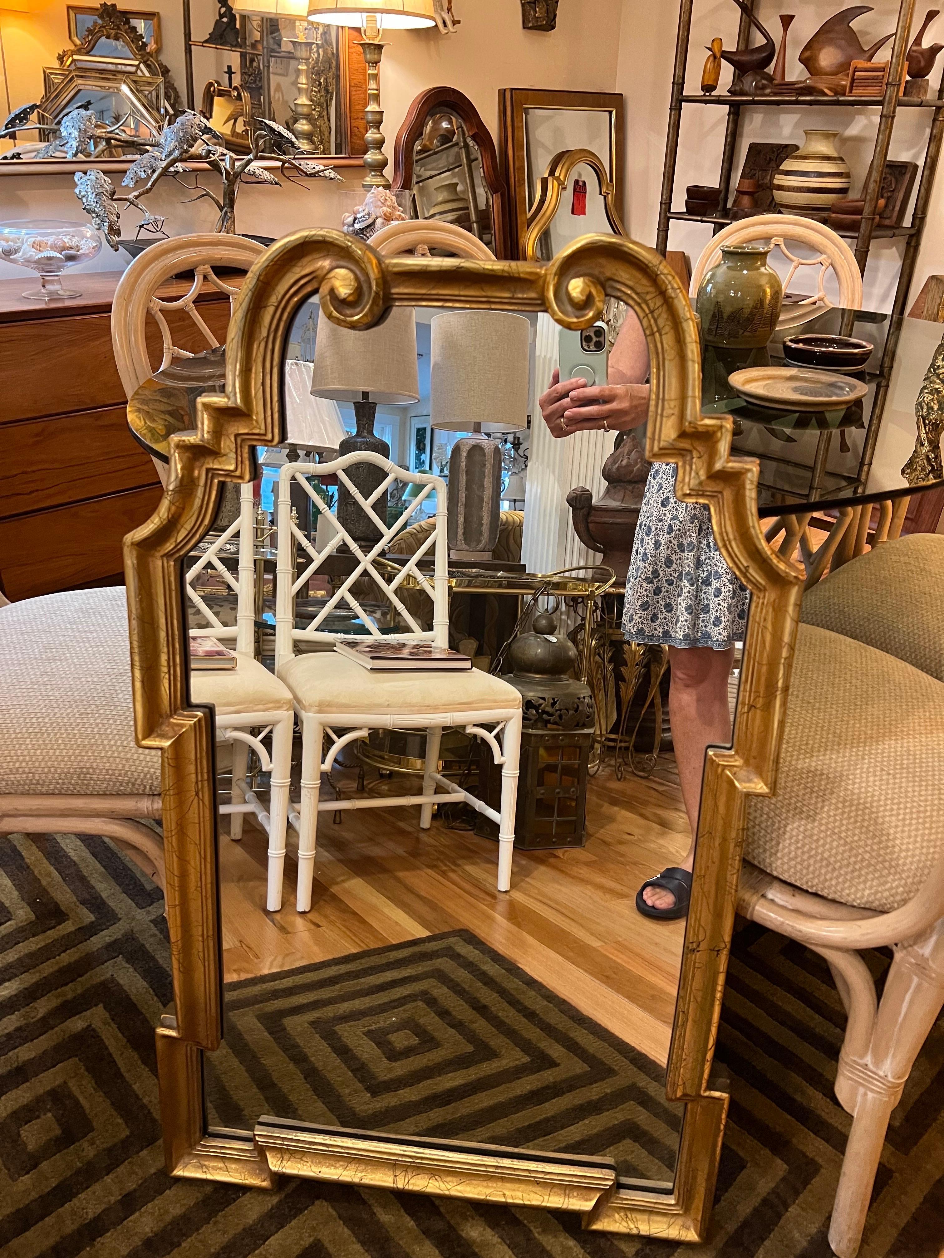 LaBarge Style Mirror in Gold Leaf. Nice heavy vintage piece. Perfect for a hallway or above a vanity.
 A heavy composition material with a speckled black design. Elegant and timeless design. 