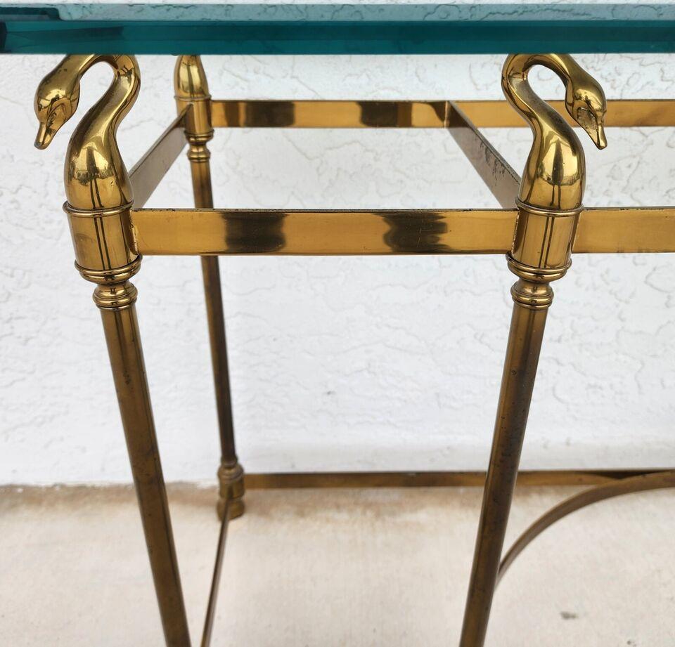 For FULL item description click on CONTINUE READING at the bottom of this page.

Offering One Of Our Recent Palm Beach Estate Fine Furniture Acquisitions Of A
Vintage Maison Jansen LaBarge Style Brass Swan & Glass Console Sofa Table

Approximate