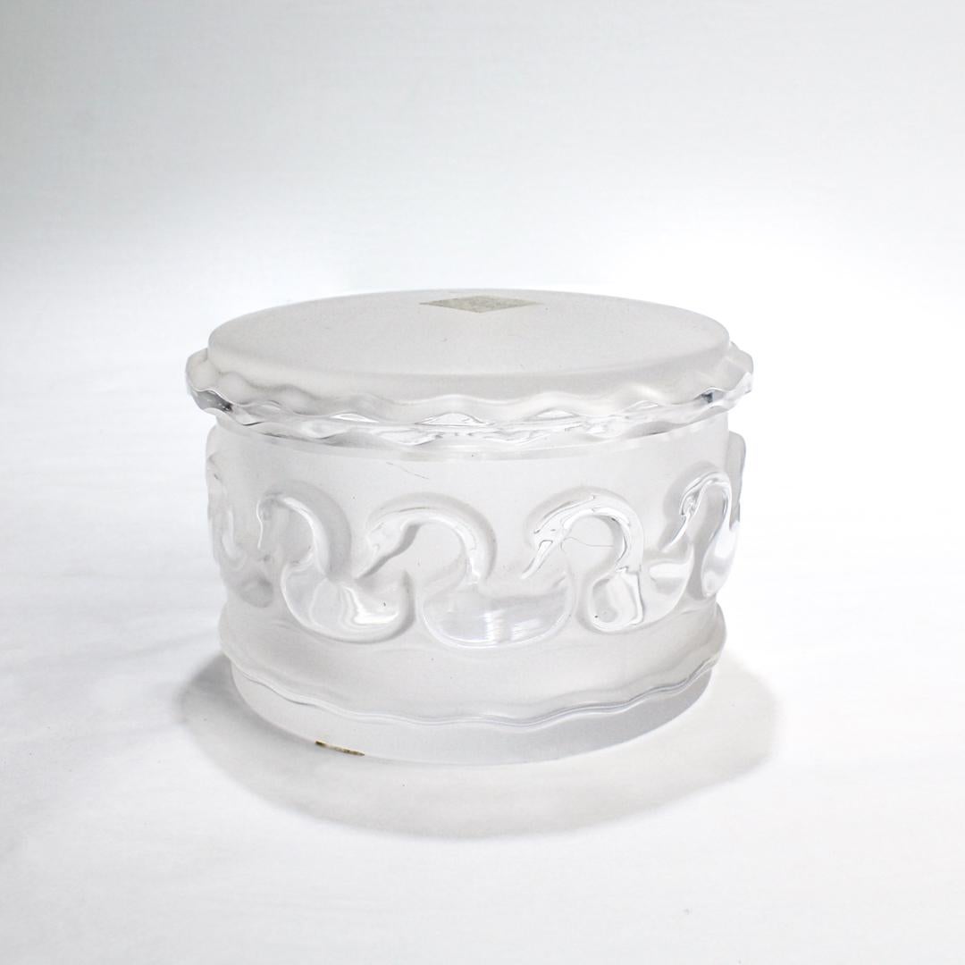 A fine, labeled covered glass box. 

By Lalique.

In the swans pattern in frosted and polished glass.

Simply a wonderful box by Lalique!

Date:
Late 20th Century

Overall Condition:
It is in overall very good as-pictured used estate condition with
