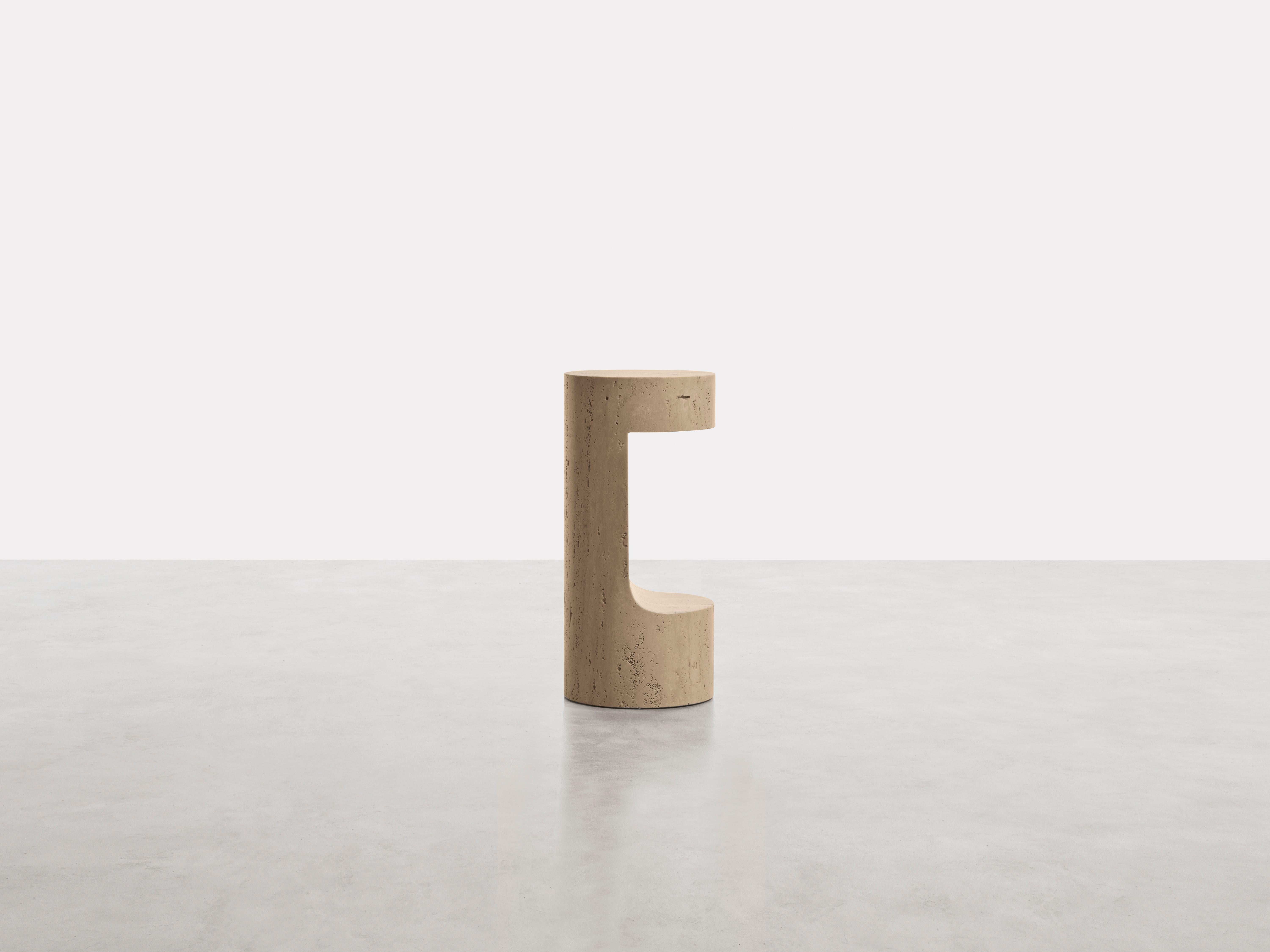 Labium Side Table by Somaschini
Dimensions: D 25 x H 55 cm
Materials: Monolithic milled structure in solid Roman Travertine.

Side table in solid Roman Travertine.

About: 
Somaschini is a new-born brand, with a strong, innovative attitude, and rich