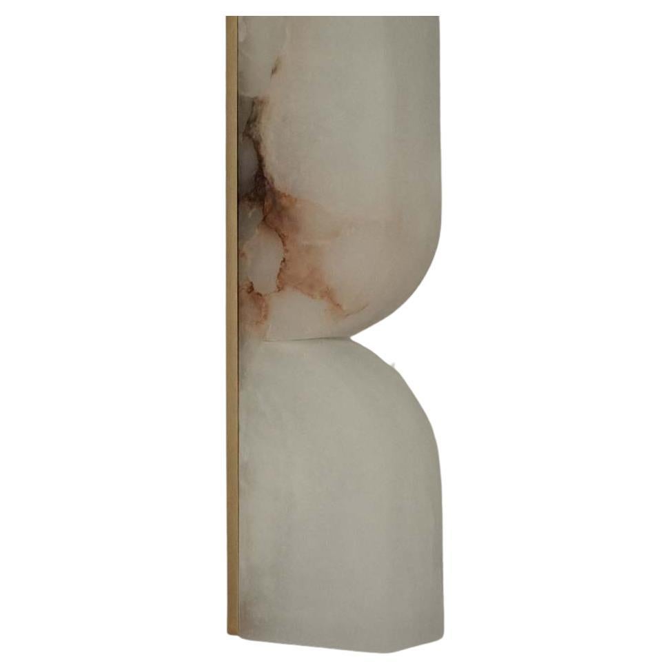Labra sconce is an exploration of stone as nature’s art, hand-chiseled and carefully shaped to perfection by masters in their craft. Honouring the rich materiality of European alabaster.

Labra is a wall-mounted LED fixture and ornamental