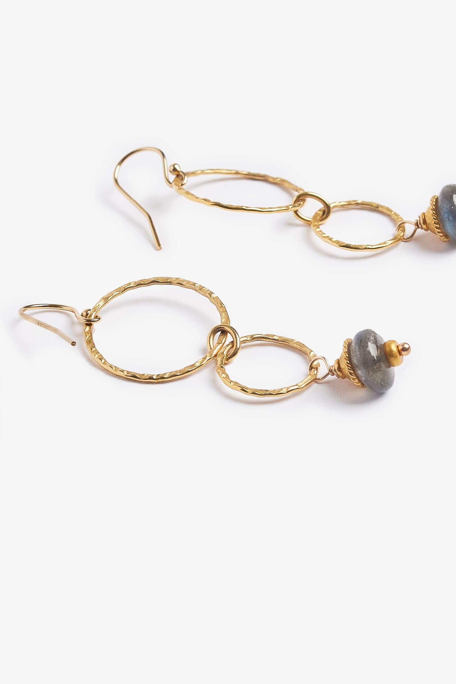 Story Behind the Jewelry
Labradorite is a grey iridescent stone with blue and green hues.  The handmade earrings are adorned with 14K hammered gold filled.  The earrings a perfect touch to any outfit.

Properties
Labradorite is a protective stone