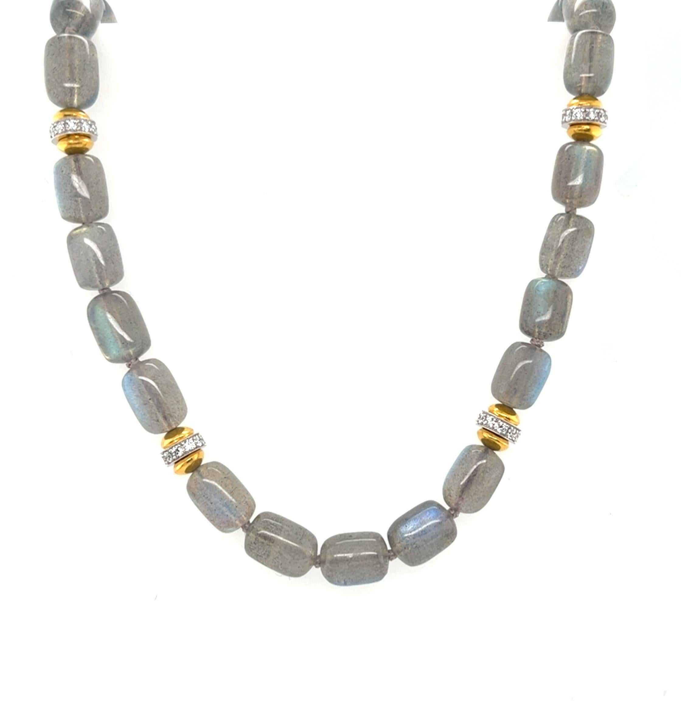 This beautifully elegant necklace features eye-catching labradorite beads arranged with diamond-set 18k gold accents. The rounded drum-shaped labradorite beads measure approximately 11 x 9mm and have stunning silver-gray body color with subtle