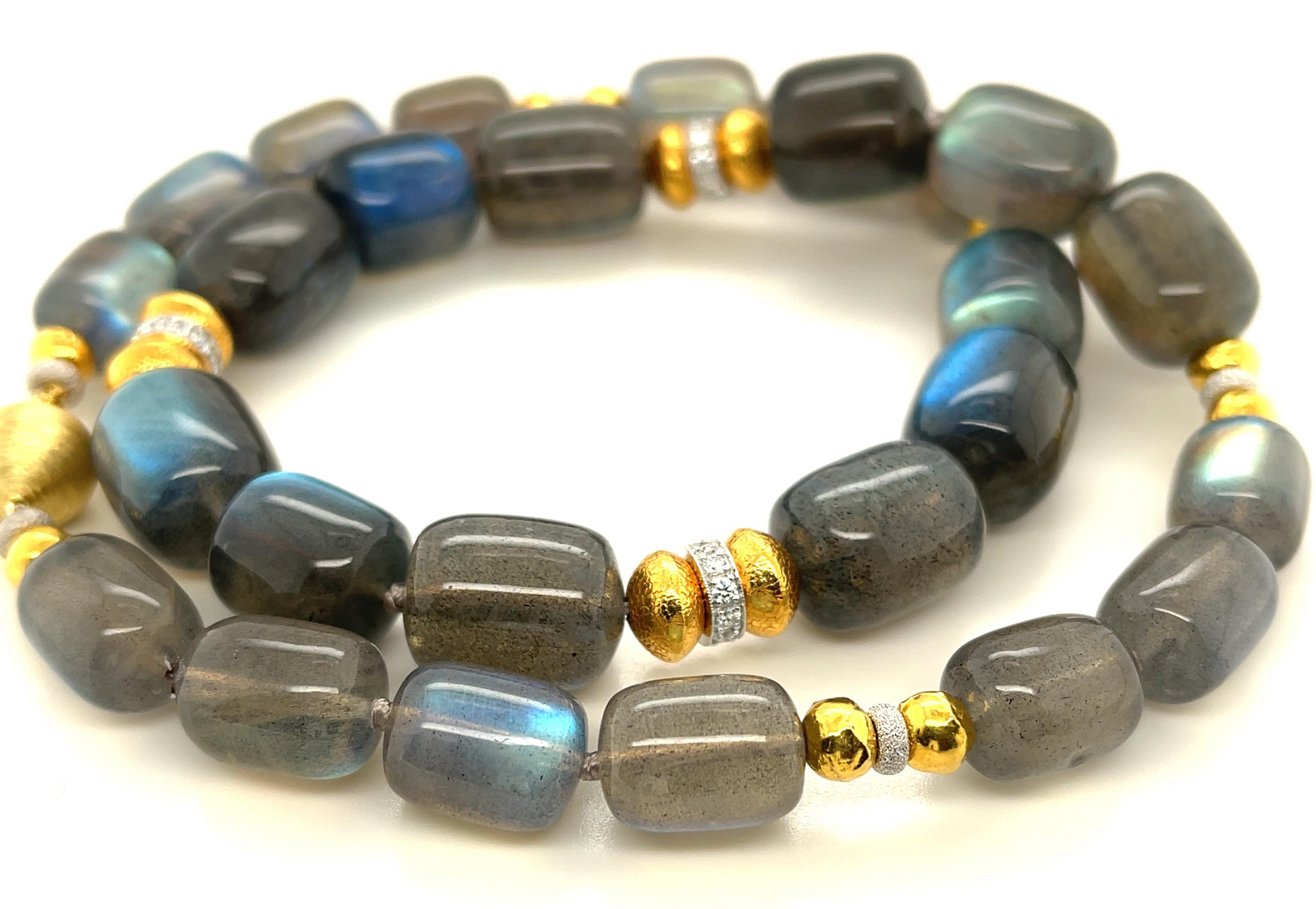 This gorgeous necklace features a beautiful collection of  barrel-shaped labradorite beads displaying fine quality 