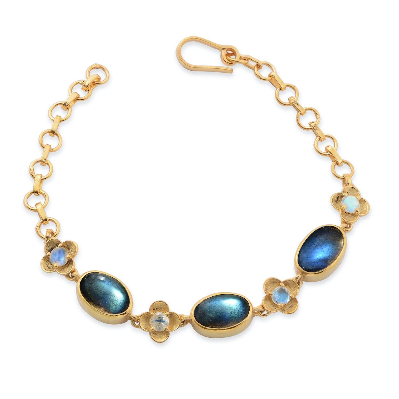 

This lovely bracelet has been handmade in our workshops. We have used labradorite and rainbow moonstone gemstones in this bracelet.

The bracelet is made in sterling silver coated with 24ct gold vermeil, and is adjustable.

It has matching
