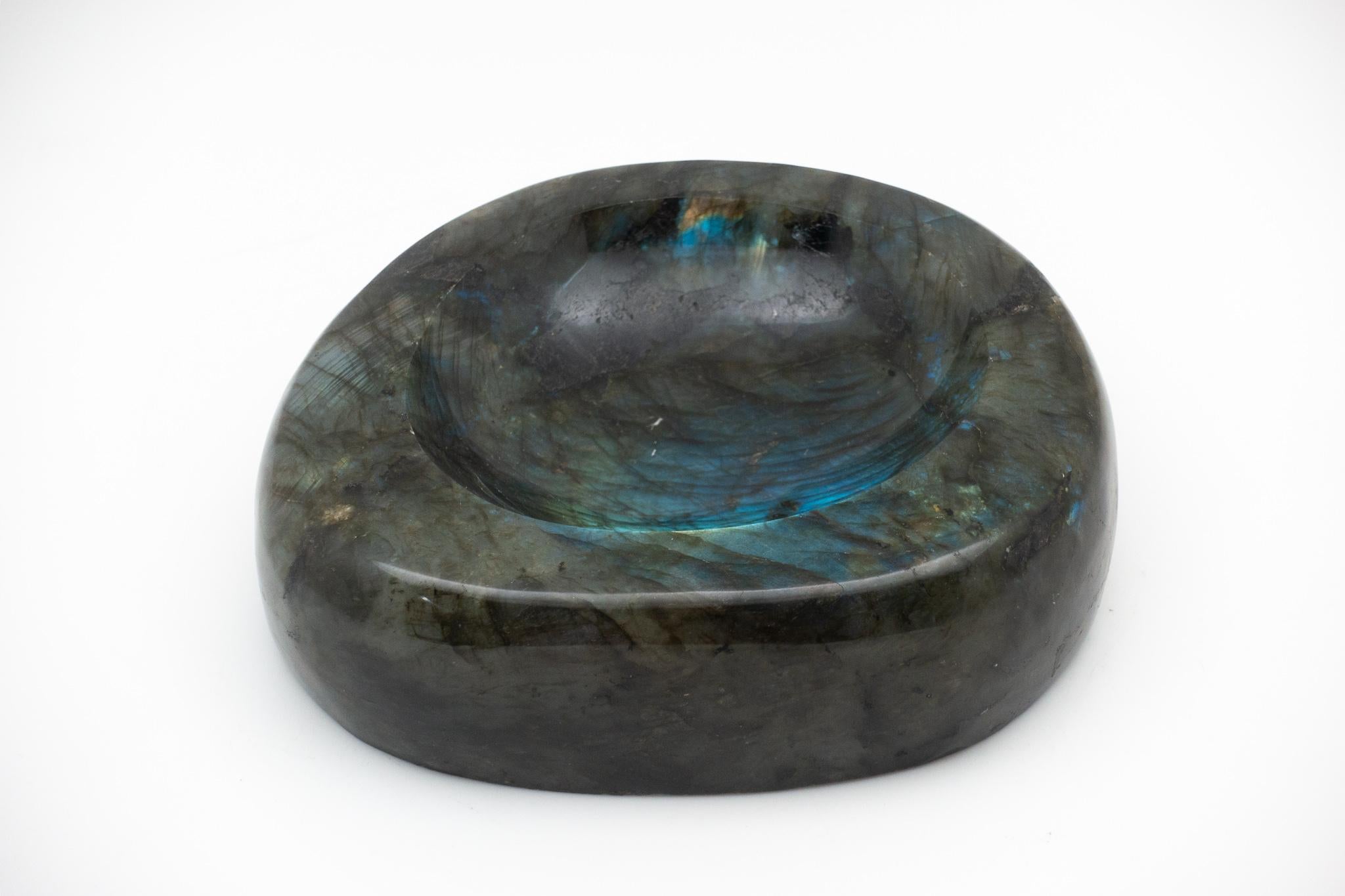 Beautiful, hand-carved giant labradorite vide-poche from Madagascar, selected for its beautiful illuminious nature and unusually large size. A very impressive desk or table item it can also be used as receptacle for keys etc, which is where the name