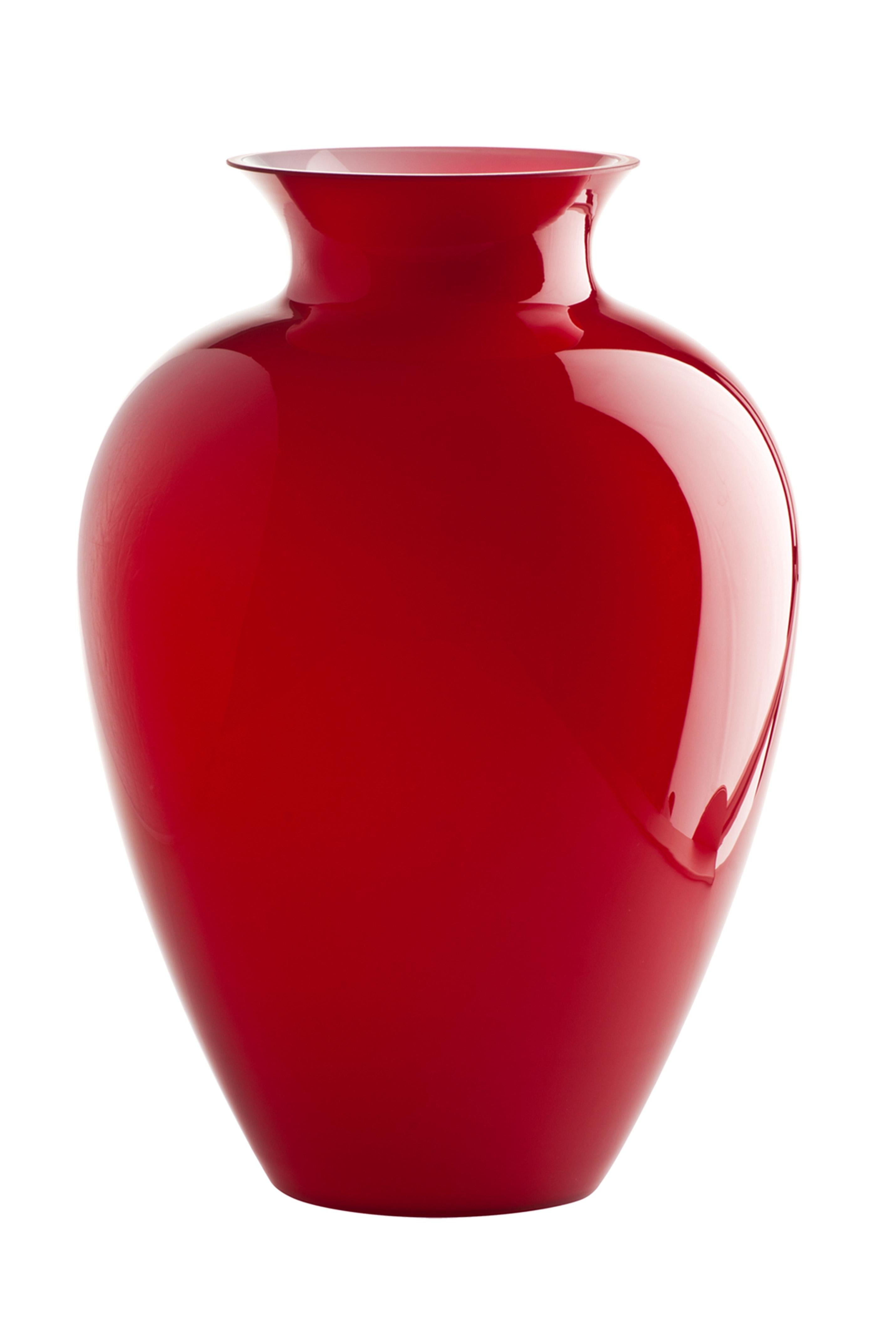 Venini glass vase with full, round body and funnel shaped neck in red. Perfect for indoor home decor as container or strong statement piece for any room.

Dimensions: 27.5 cm diameter x 38.5 cm height.