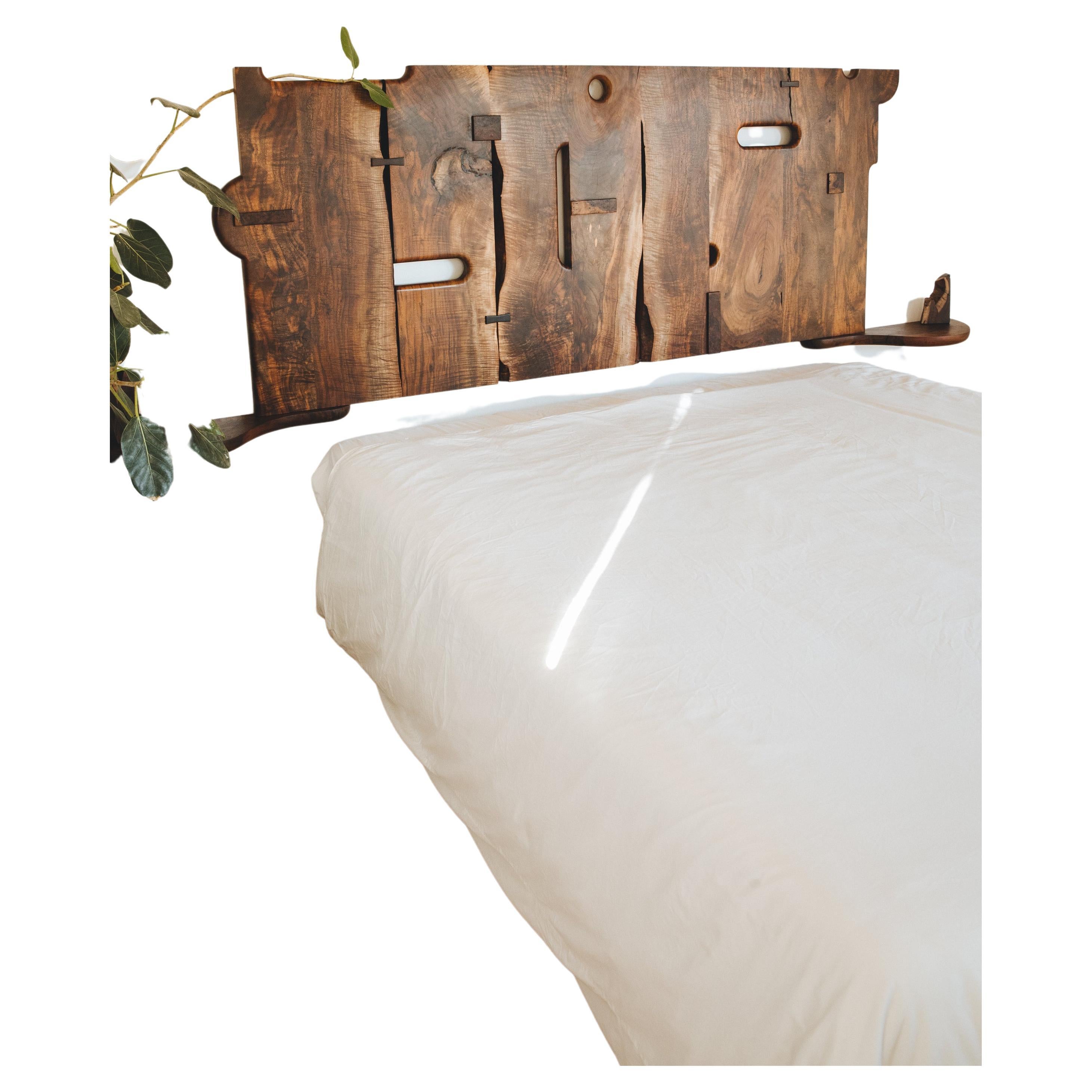 Sculptural Headboard featuring hand-shaped Claro and Oregon Black walnut with Claro burl patches and ebony keys. Attached side tables made from slab offcuts.