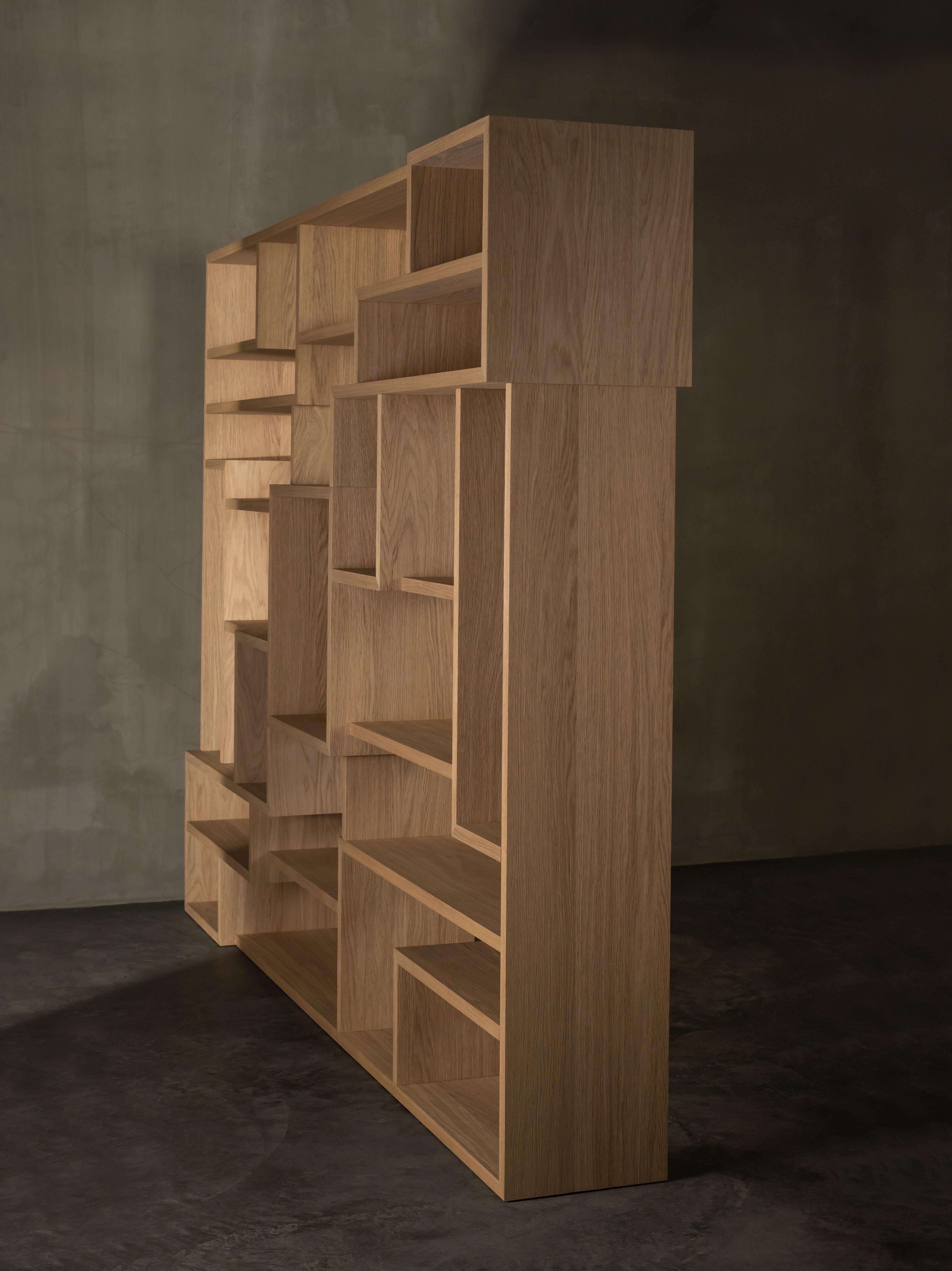 Labyrinth screen by Kana Objects
Dimensions: D 45 x W 291 x H 211 cm
Materials: Natural oak.
Also available in smoked oak.
Other modules available. 

Labyrinth both dominates and embraces the space at the same time. The wood version is much