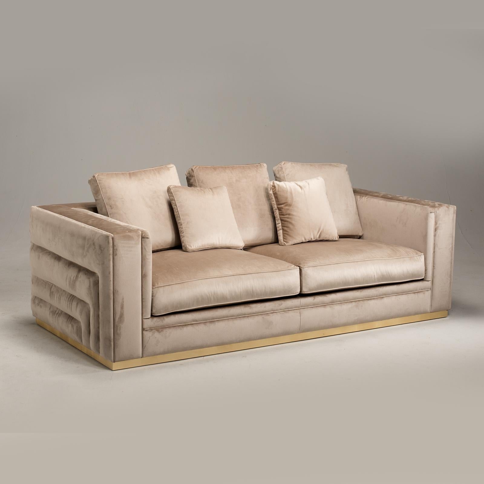 The Labyrinth sofa combines old with new to bring a cosmopolitan touch to any contemporary living space. Boasting clean lines to create a geometric silhouette, this glamorous sofa is upholstered in ultra-soft velvety fabric. Set on a square gold