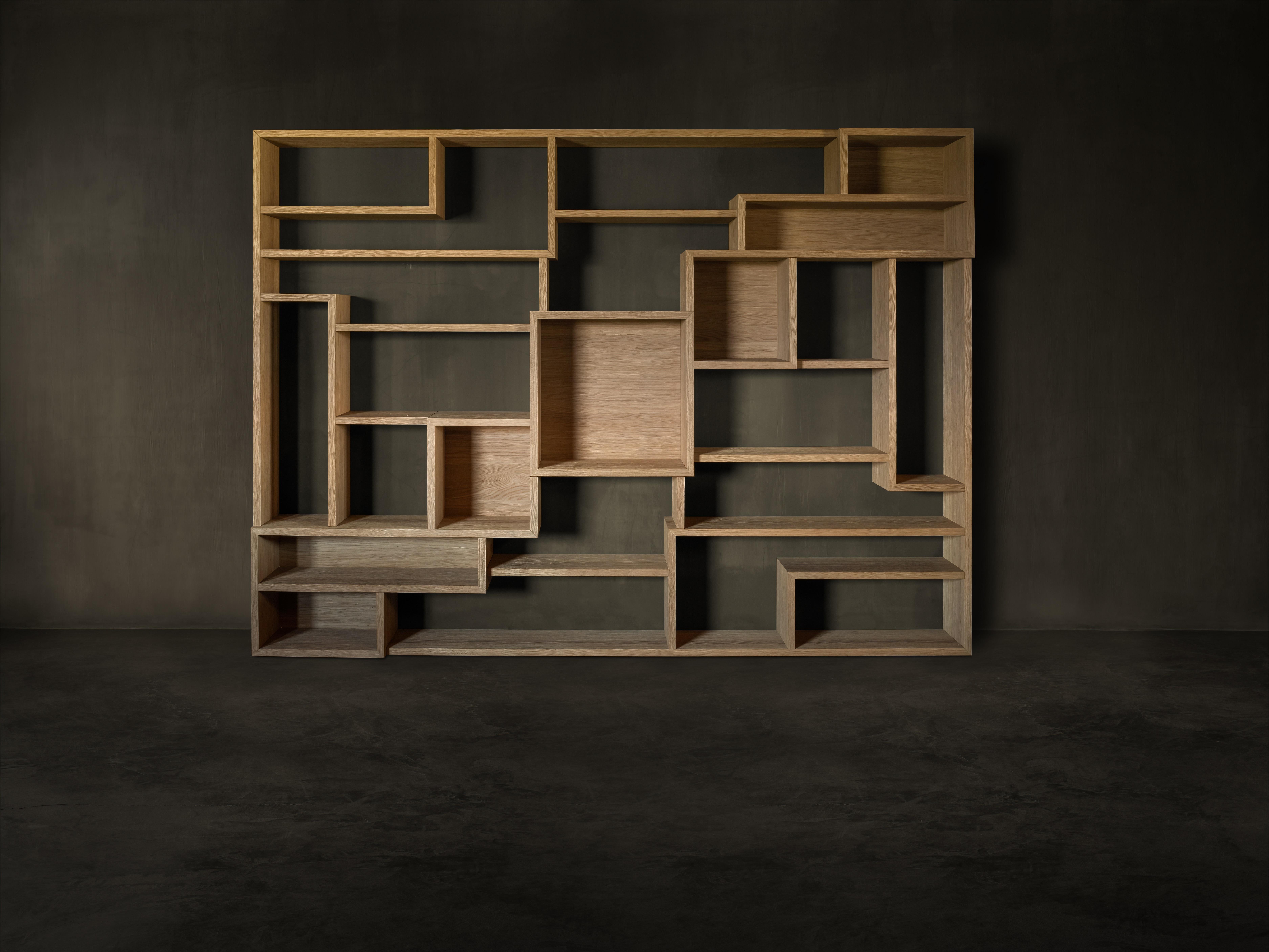 Labyrinth wall bookshelf by Kana Objects.
Dimensions: D 40 x W 291 x H 211 cm.
Materials: natural oak.
Also available in smoked oak.
Other modules available.

Labyrinth is a graphic sculpture for both storing the books and objects you cherish