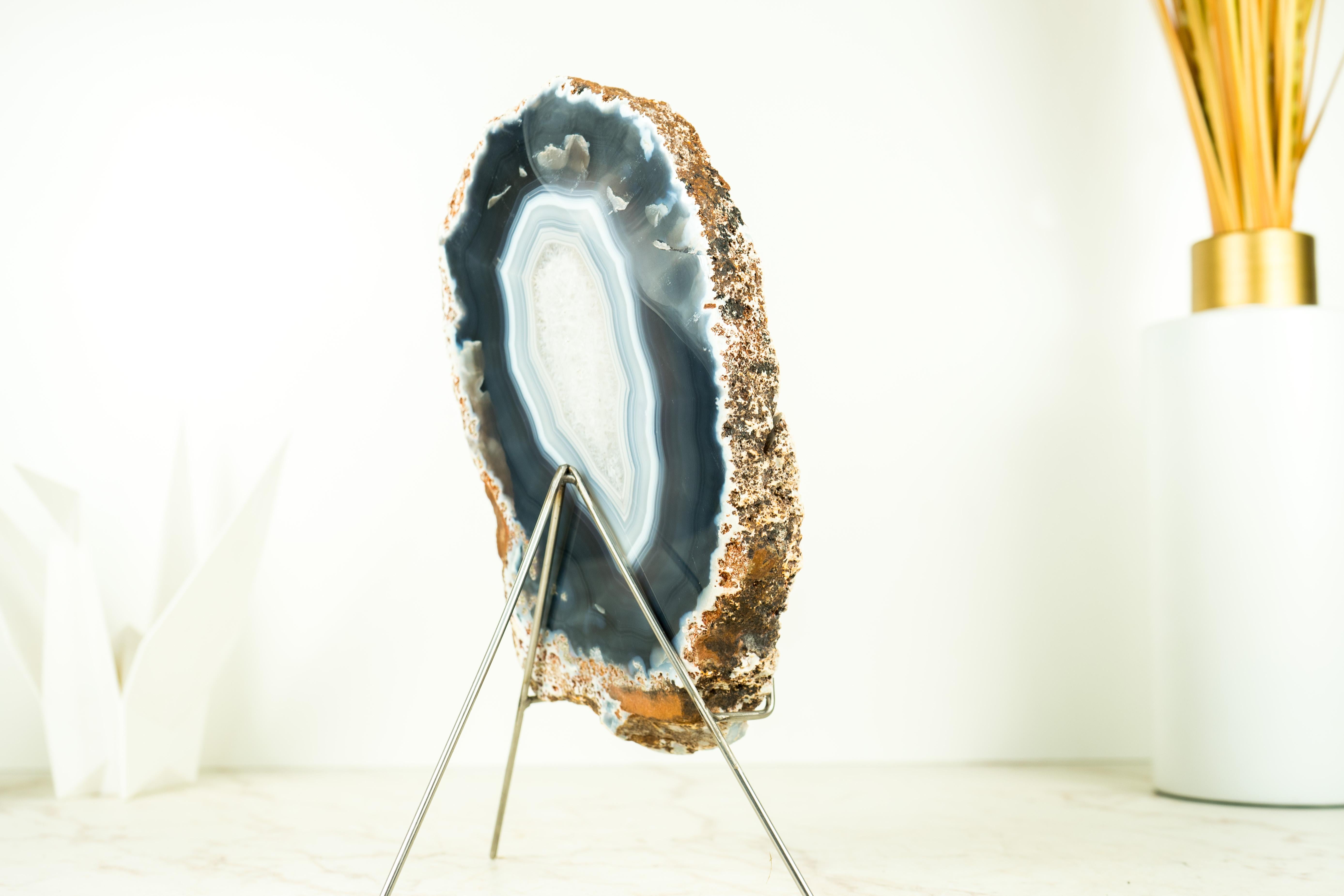Natural Blue Banded Agate Geode with Blue and White Laces

▫️ Description

Gorgeous and intact, with superb blue and white agate laces (also known as Blue Lace Agate), this agate geode is considered to be of Super Extra quality due to its beauty,