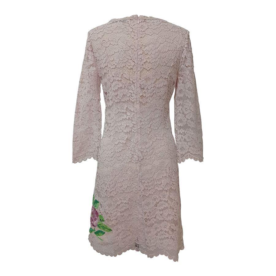 Nylon (60%) and cotton Silk lining Antique rose color 3/4 sleeve Amazing total construction of fine lace Multicolored floral embroideries Shoulder/hem length cm 85 (334 inches) Shoulder cm 38 (149 inches)
