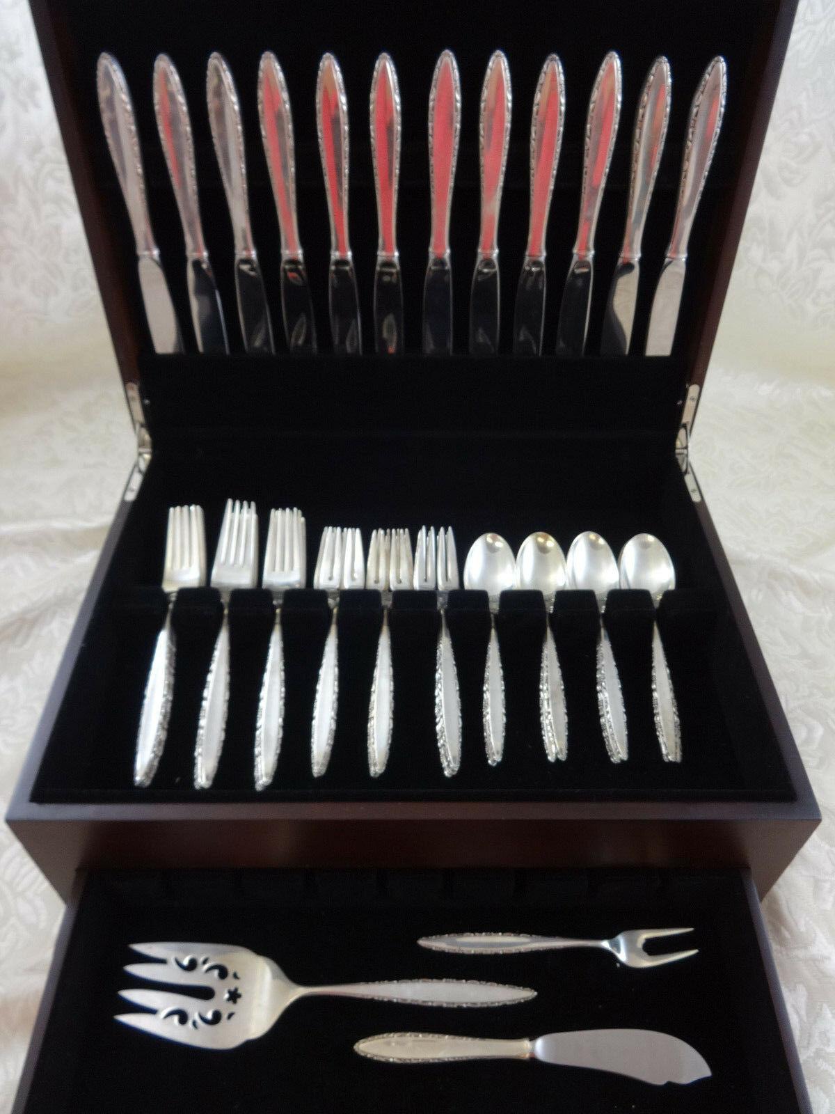 Lace point by Lunt sterling silver flatware set - 51 pieces. This set includes:

12 knives, 9