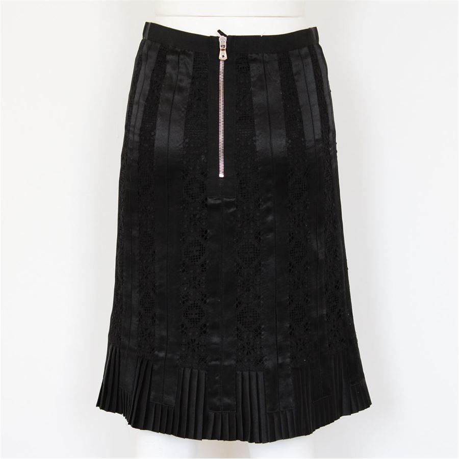 Silk (60%) cotton (38%) Black colour Lace decorations Plissé bottom Silk lining Back zip closure Total length cm 58 (22.8 inches)
