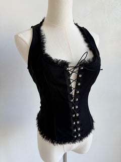 Camiseta corsé con cordones y ribetes deshilachados