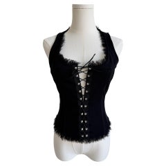 Camiseta corsé con cordones y ribetes deshilachados