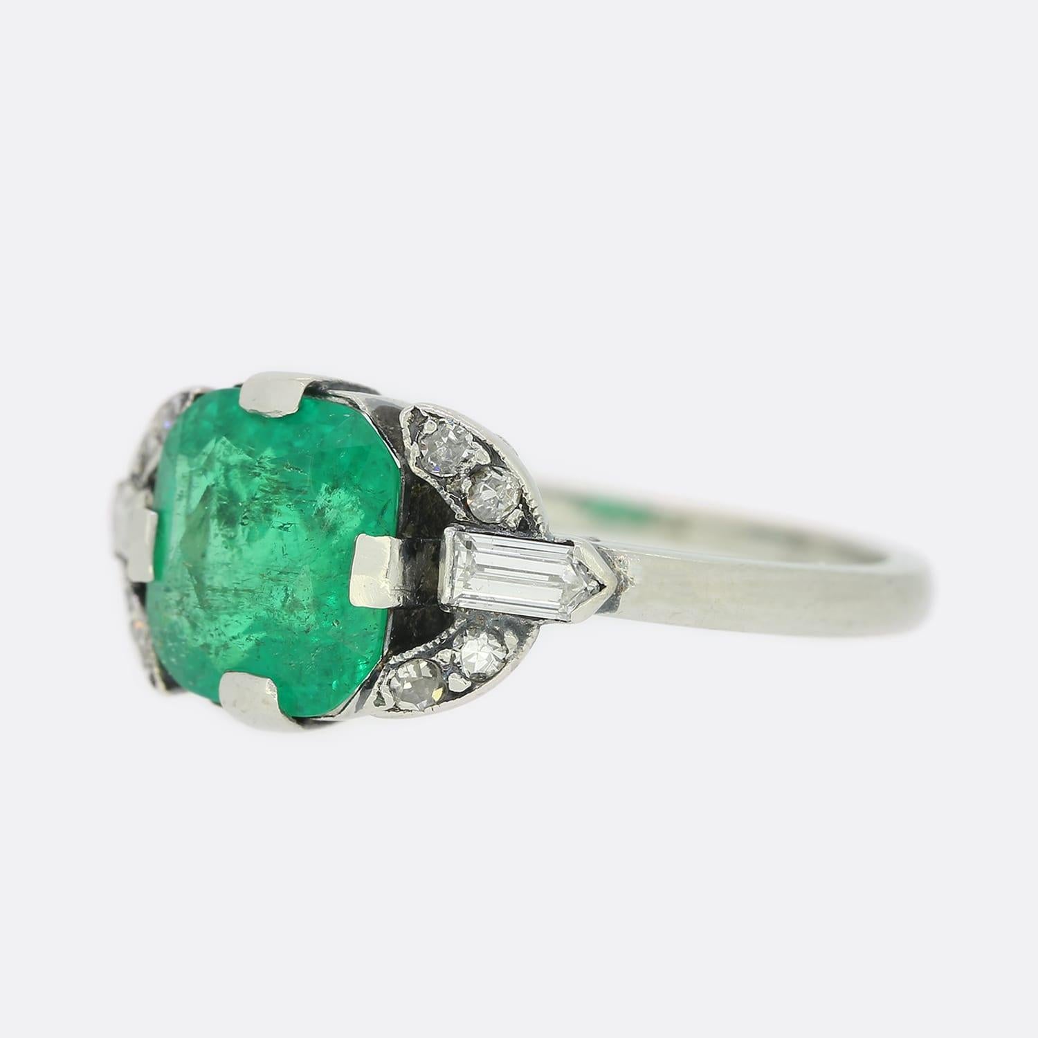 This is an Art Deco emerald and diamond ring from Lacloche. The central emerald is a lovely rich green tone and most likely of Colombian origin. Each shoulder is set with 4 old cut diamonds and a custom cut pointed baguette cut diamond.

Condition: