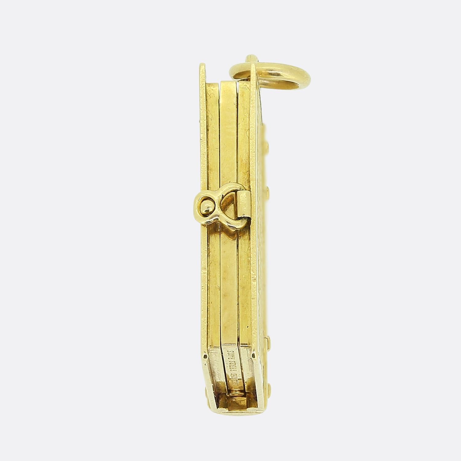 Here we have a beautiful creation from the luxury French jewellery designer LaCloche Frères. This antique piece has been crafted from a rich 18ct yellow gold into the shape of a book with a detailed curved spine and engraved bow garland motif