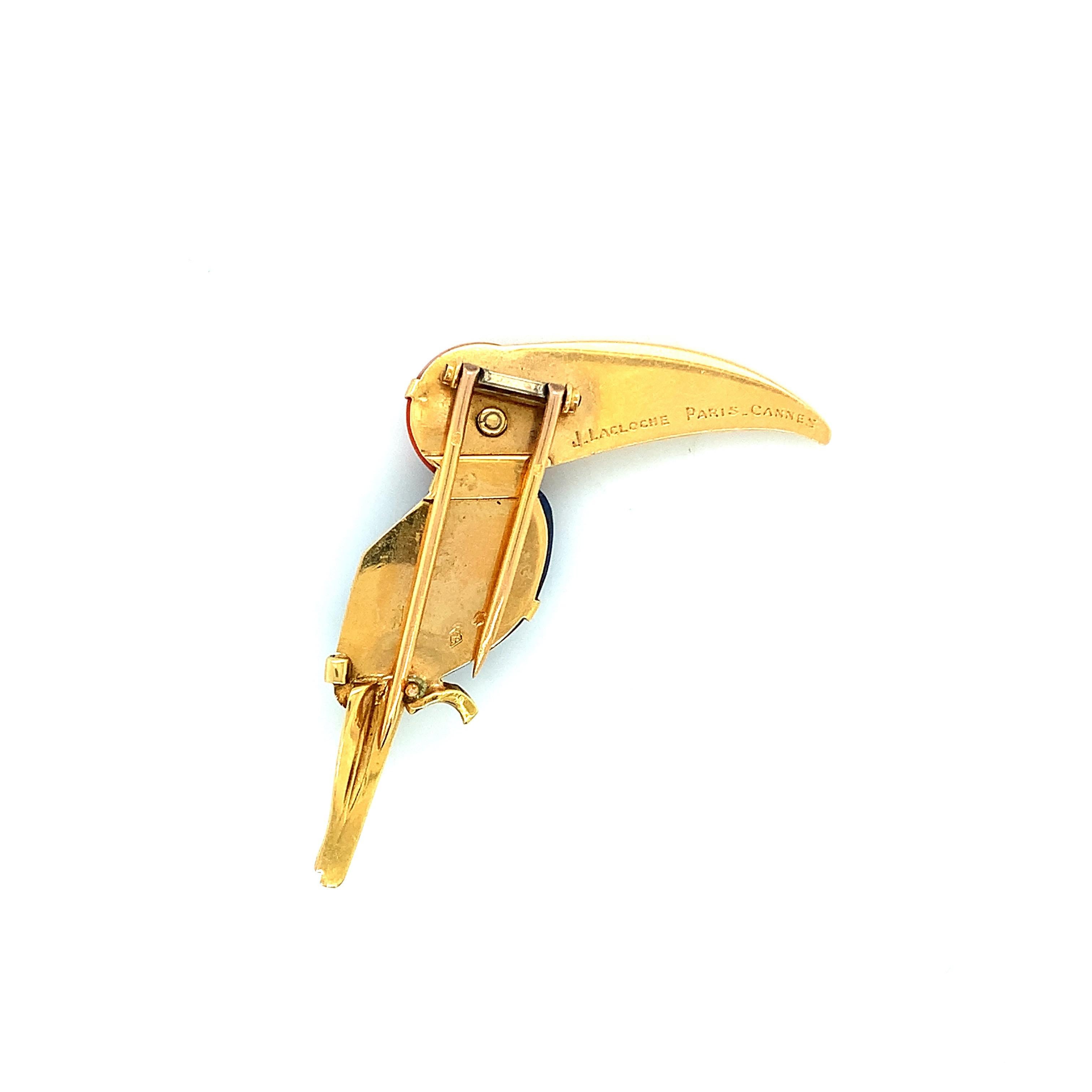 LaCloche gold brooch of a toucan bird made out of yellow gold, chalcedony, and coral. Made in France, it is a unique piece of jewelry with a creative fauna design. Marked: LaCloche / Paris / Cannes. Total weight: 7.6 grams. Width: 1.75 inch. Length: