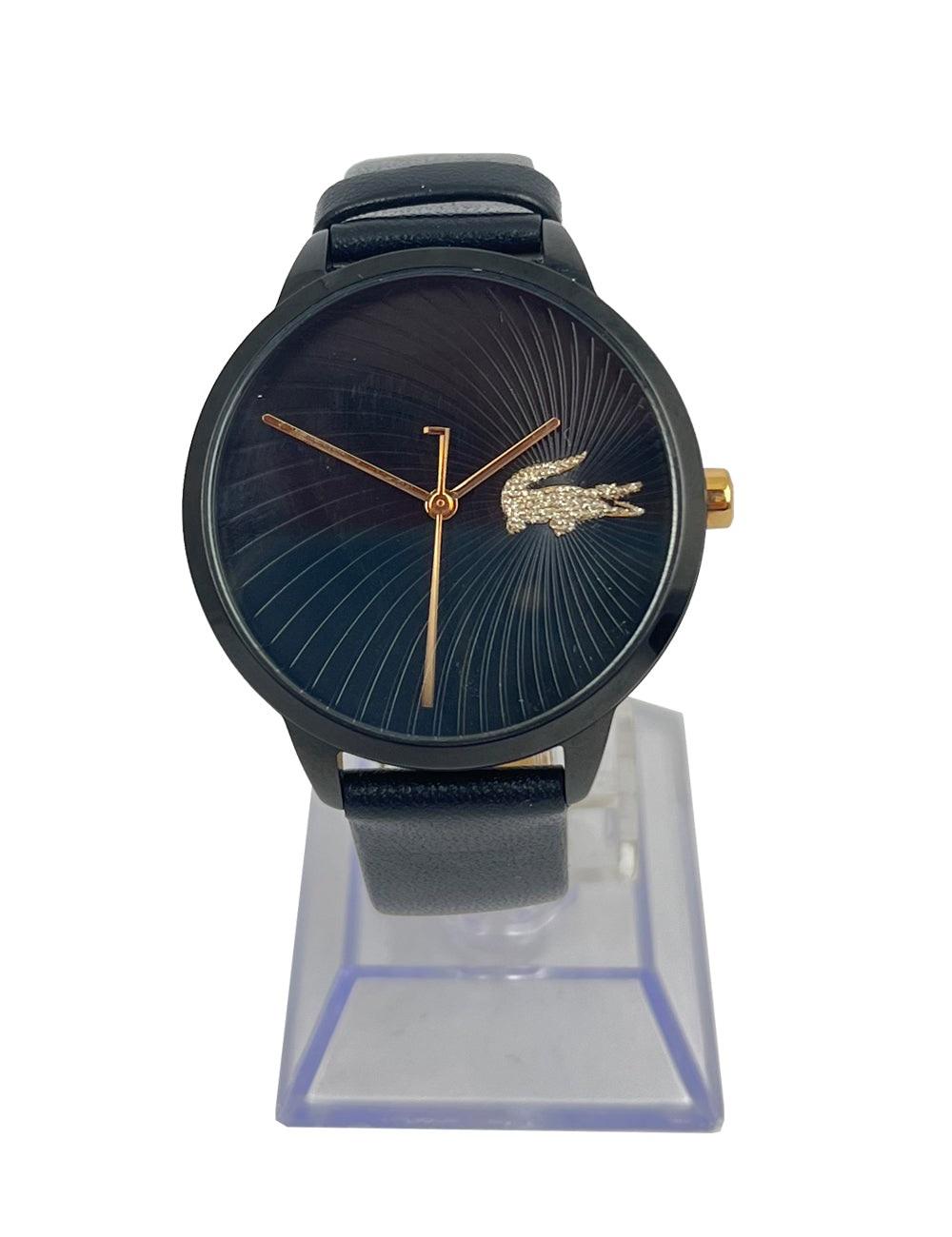 All-black stainless steel Lacoste watch with glitter Lacoste crocodile detail on round watch face.

Additional information:
Overall condition: Great
Extras: Includes original box
