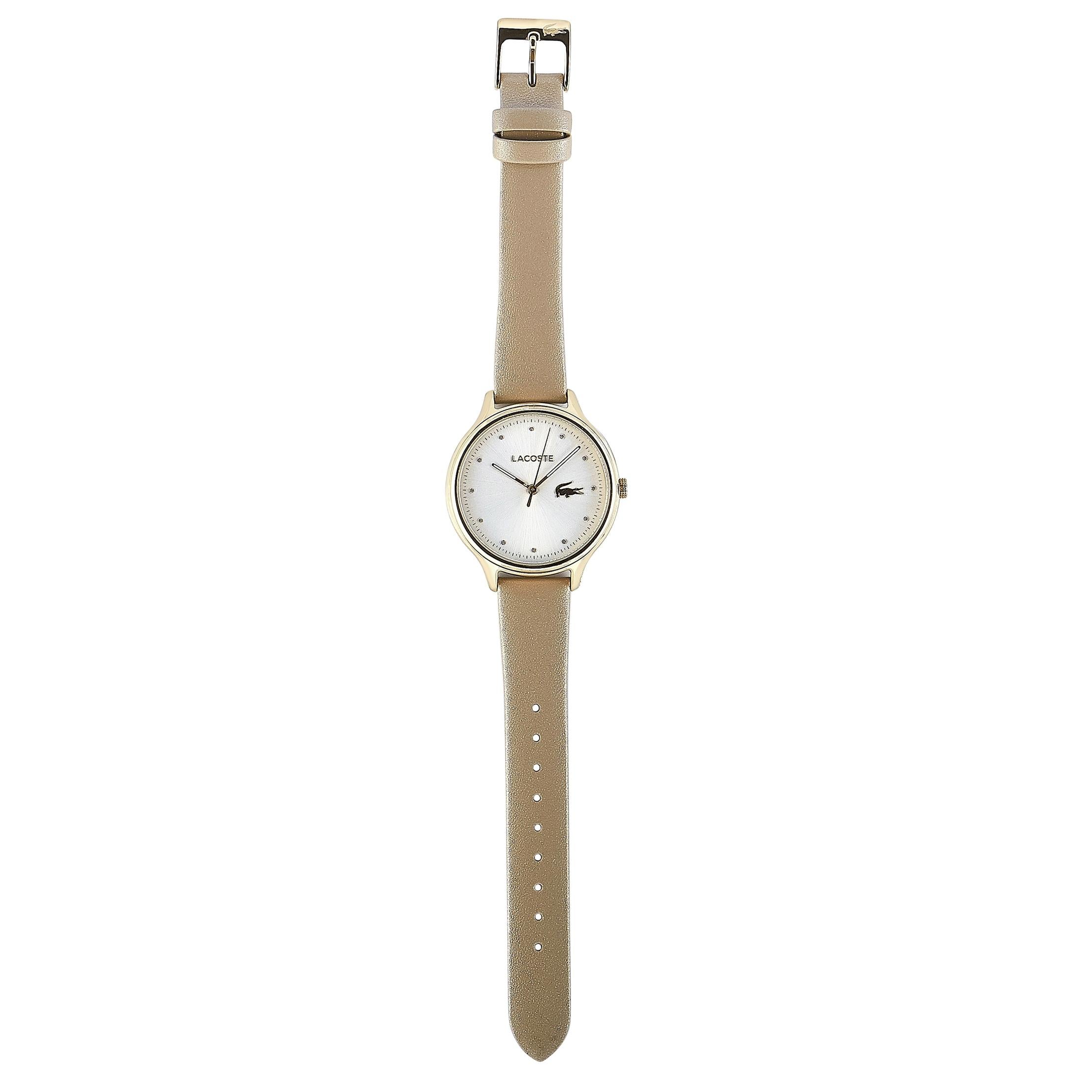 This is the Lacoste Constance watch, reference number 2001007.
 
 It is presented with a gold-tone stainless steel case that measures 38 mm in diameter. The case is water-resistant to 30 meters and mounted onto a pearly beige leather strap,