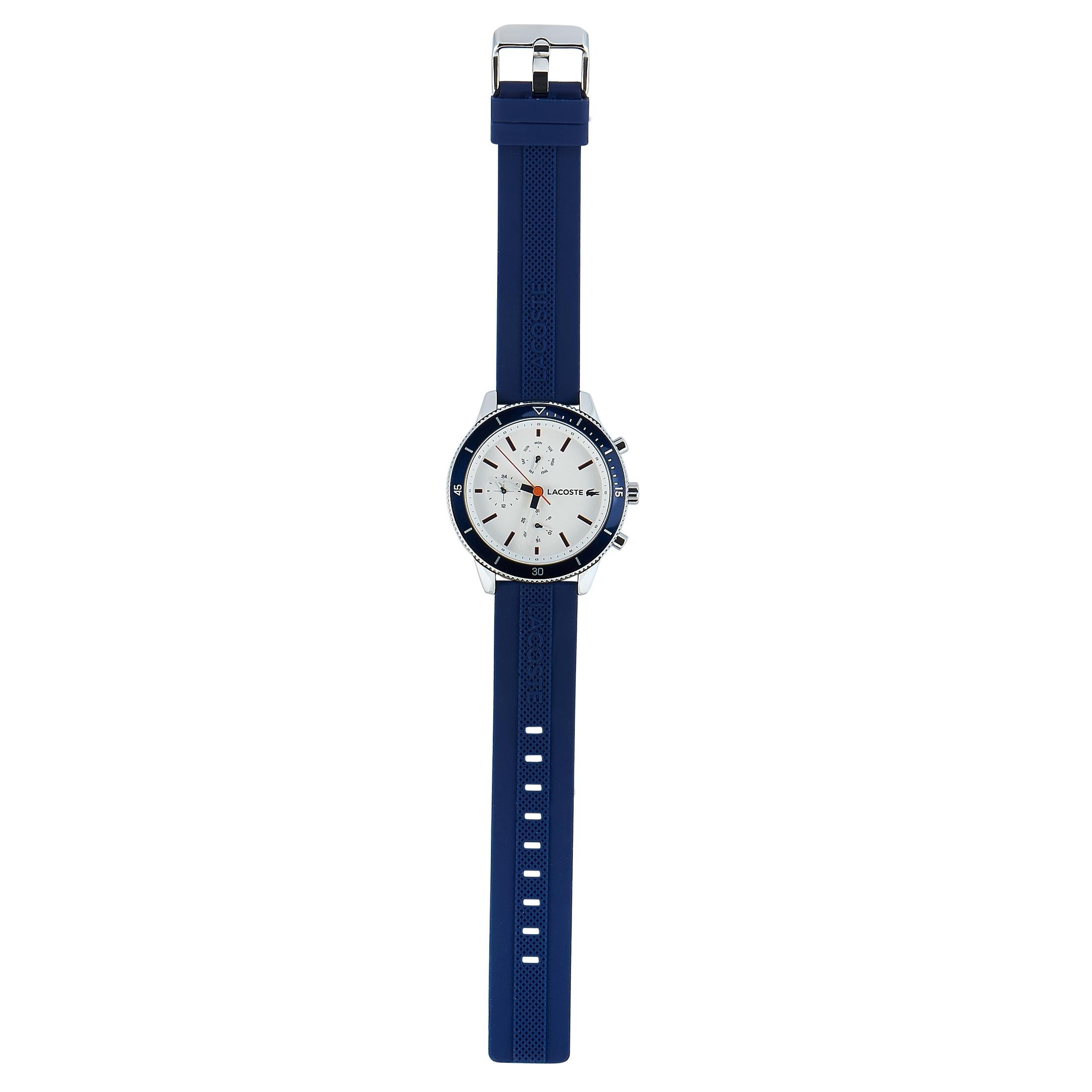 This is the Lacoste Key West watch, reference number 2010993.

It is presented with a 44 mm stainless steel case fitted with a blue aluminum bezel. The case is water-resistant to 50 meters and mounted onto a blue silicone strap, secured on the wrist