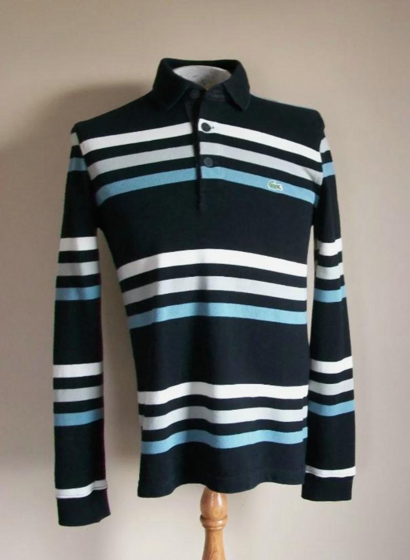 LACOSTE - Camicia da uomo in pile stile rugby con colletto in maglia - abbottonatura a tre bottoni - spacchetti laterali - polsini in maglia - 100% cotone - taglia XS - acquistata nuova presso il negozio Lacoste di Toronto (Bloor Street).

Buone