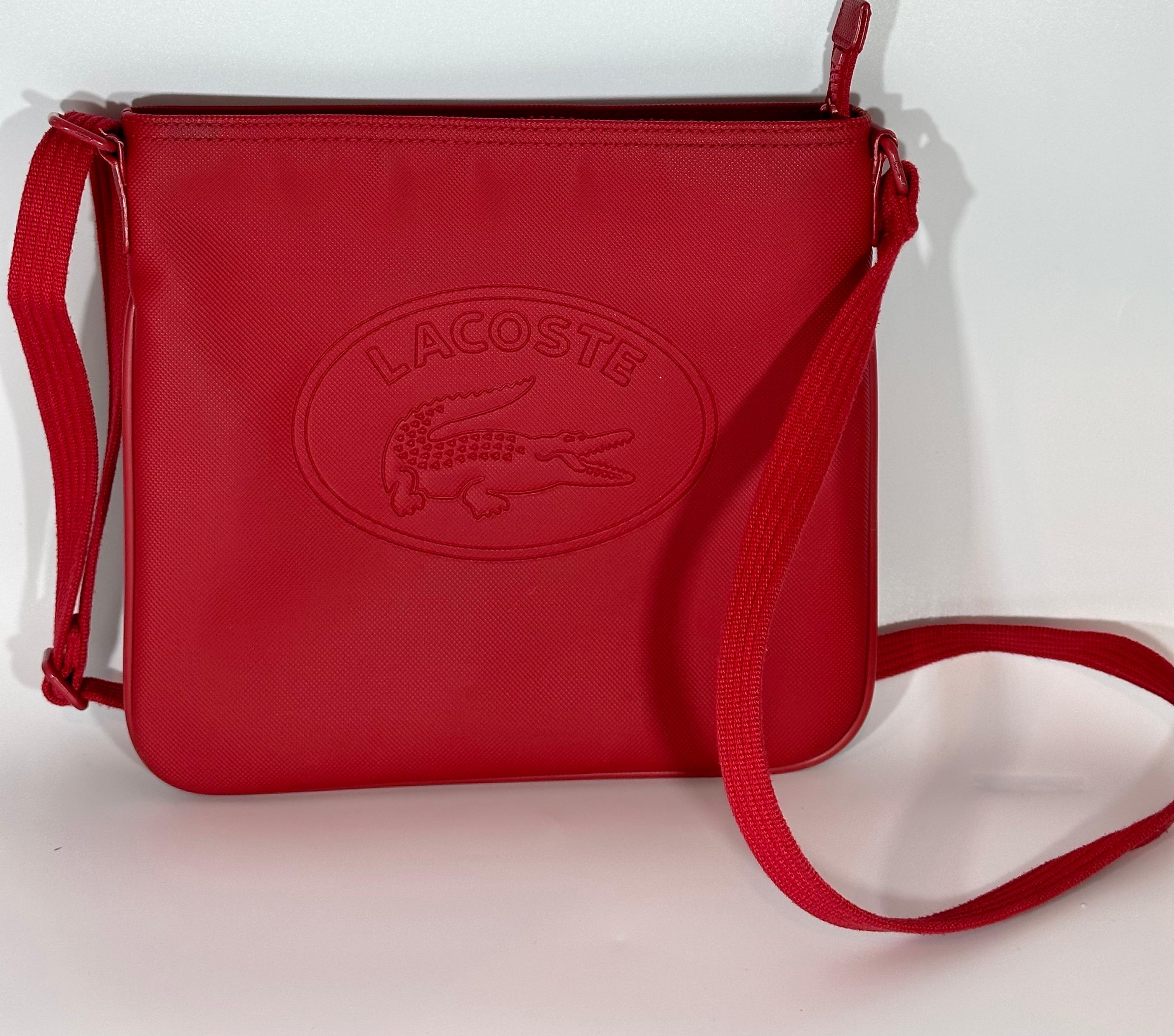 LACOSTE Over the shoulder crossbody bag. Lacoste , Ultra Light, Red Color In Excellent Condition In New York, NY