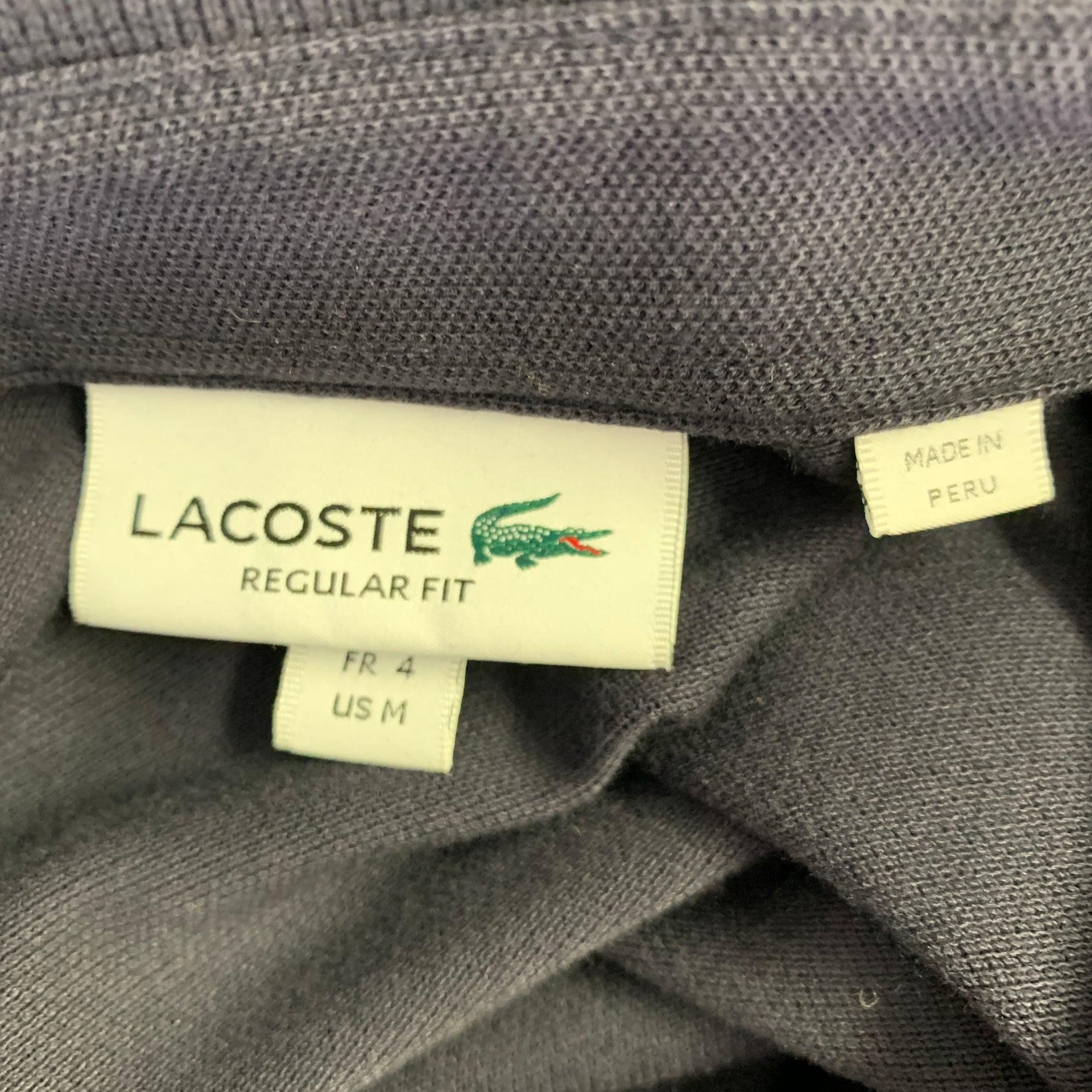 Polo con bottoni nascosti LACOSTE Taglia M Navy in misto cotone, vestibilità regolare In condizioni ottime in vendita a San Francisco, CA