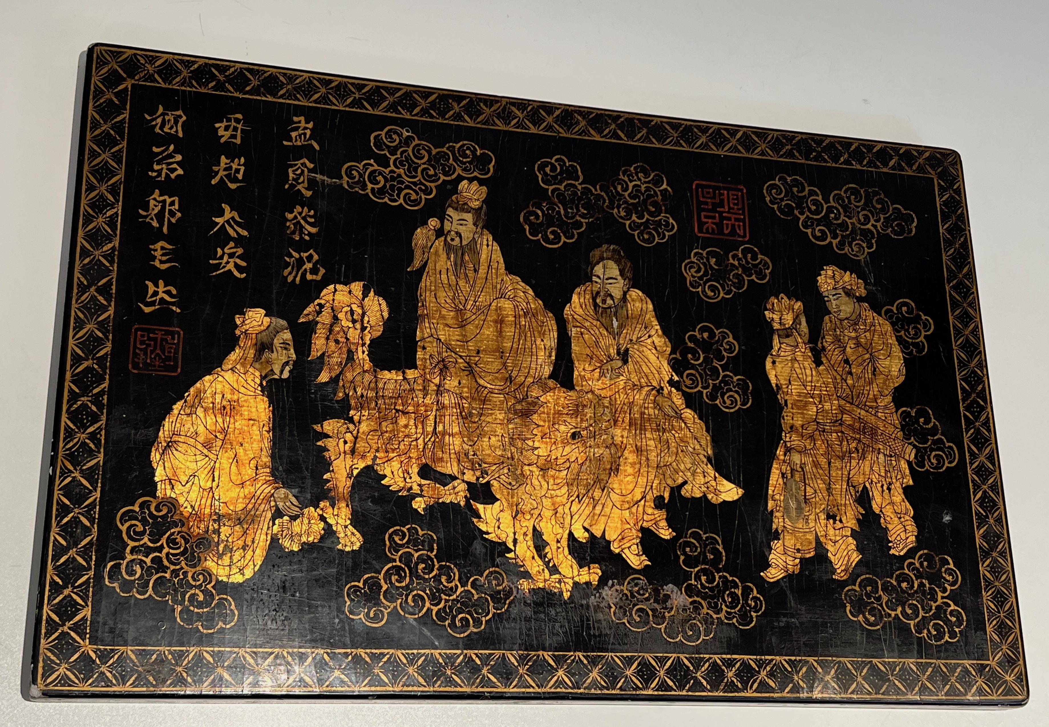 This beautiful lacquered and gilding painting has been made on a wooden panel. The painting represents Chinese characters, one of them riding a dragon. The scene is surrounded by stylized floral motifs and Chinese inscriptions. This is a French