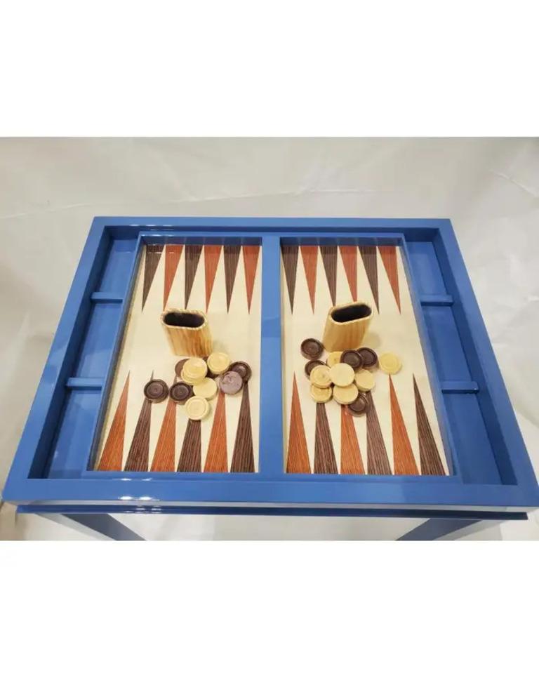 Lacquer blue table that coverts to a backgammon game table.
New production. Designed and made in NYC, each table is handcrafted within NYC and has unique attributes. One-day delivery available in NYC
