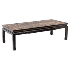 Lacquer coffee table enhanced with floral motifs. Circa 1900.