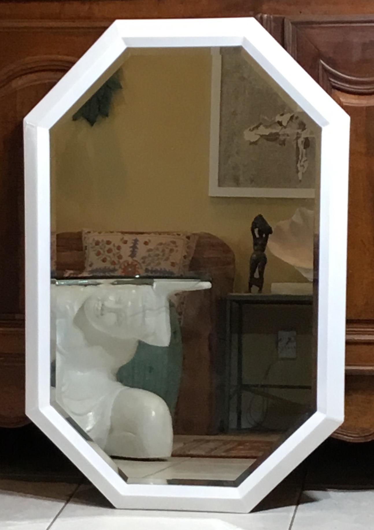 Elegant hexagon mirror made of white lacquer painted metal, with bevelled mirror glass.