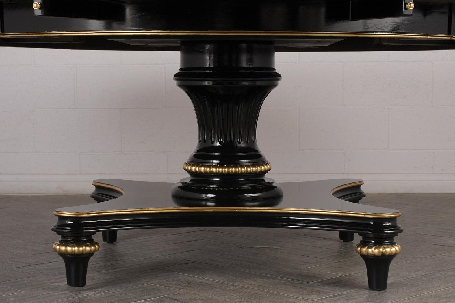 Elegant rounds dining table with extensions. The table is made from solid mahogany wood, newly lacquered finish with gilt details around the top trim and skirt. Followed by carved pedestal legs with gilt trims. Dining Table features 8 arms that pull