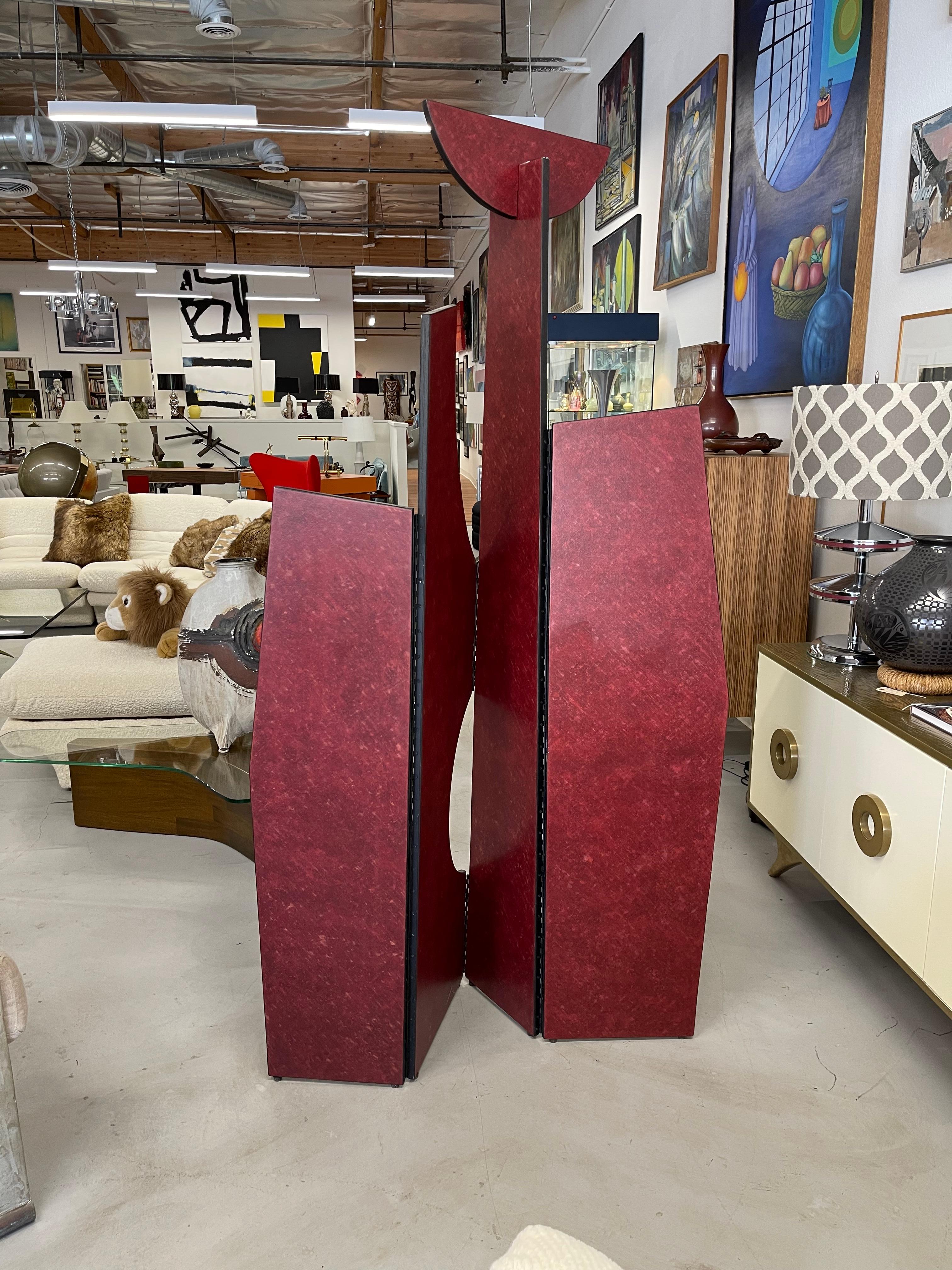 Wonderfully shaped room divider screen. Painted a rich shade of burgundy. !980’s vintage. Approximately 78 inches tall. The sections are different widths, 14, 9 16 and 12 inches wide. If spread flat, approximately 51 inches wide. In good condition