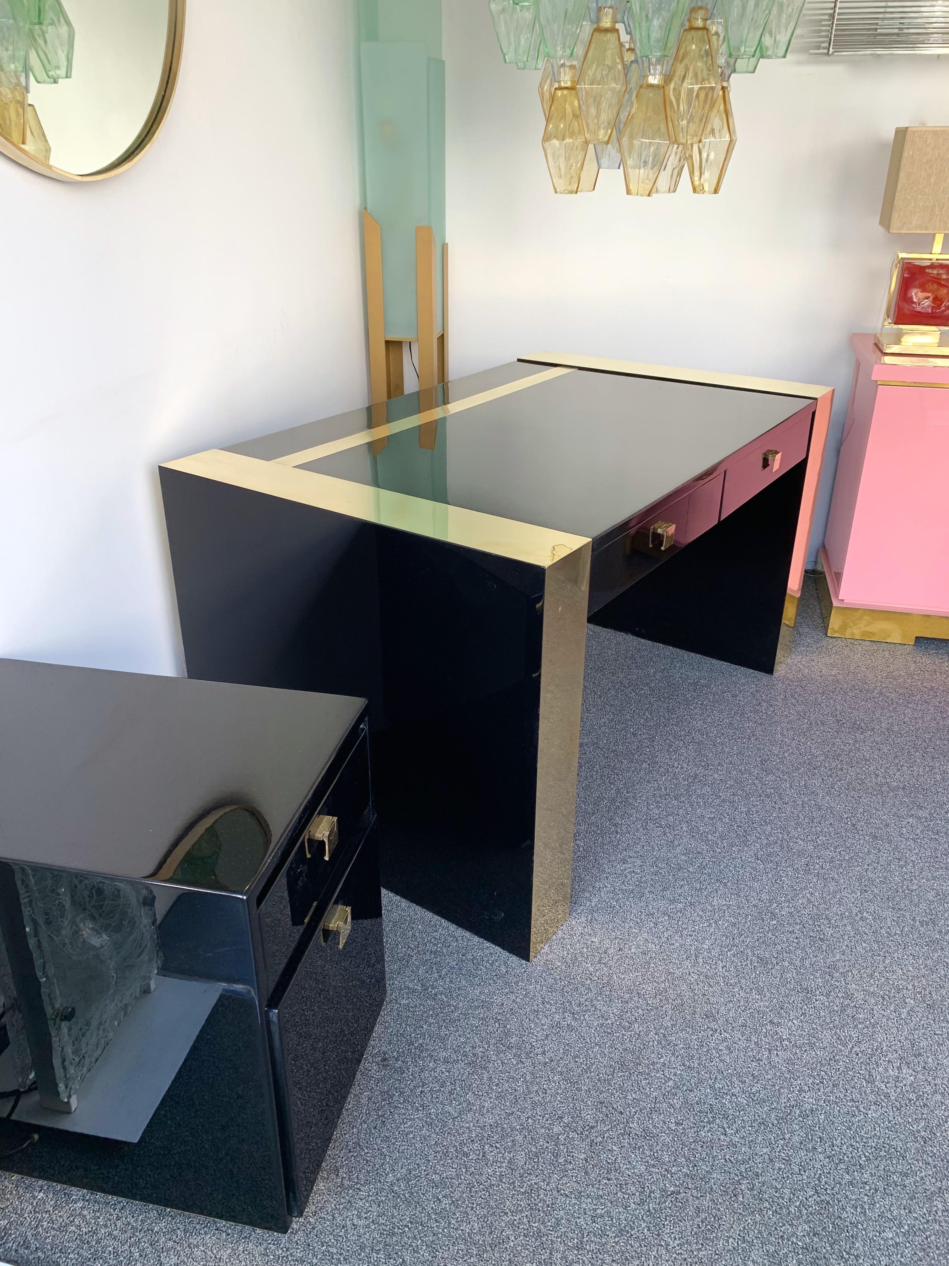 Rare black lacquered and brass desk by Jean Claude Mahey. 2 drawers in front and useful side box case. Sign on base. Side box measurements H60 x W42 x D60cms. Famous design like Guy Lefèvre for Maison Jansen, Willy Rizzo, Mario Sabot, Hollywood