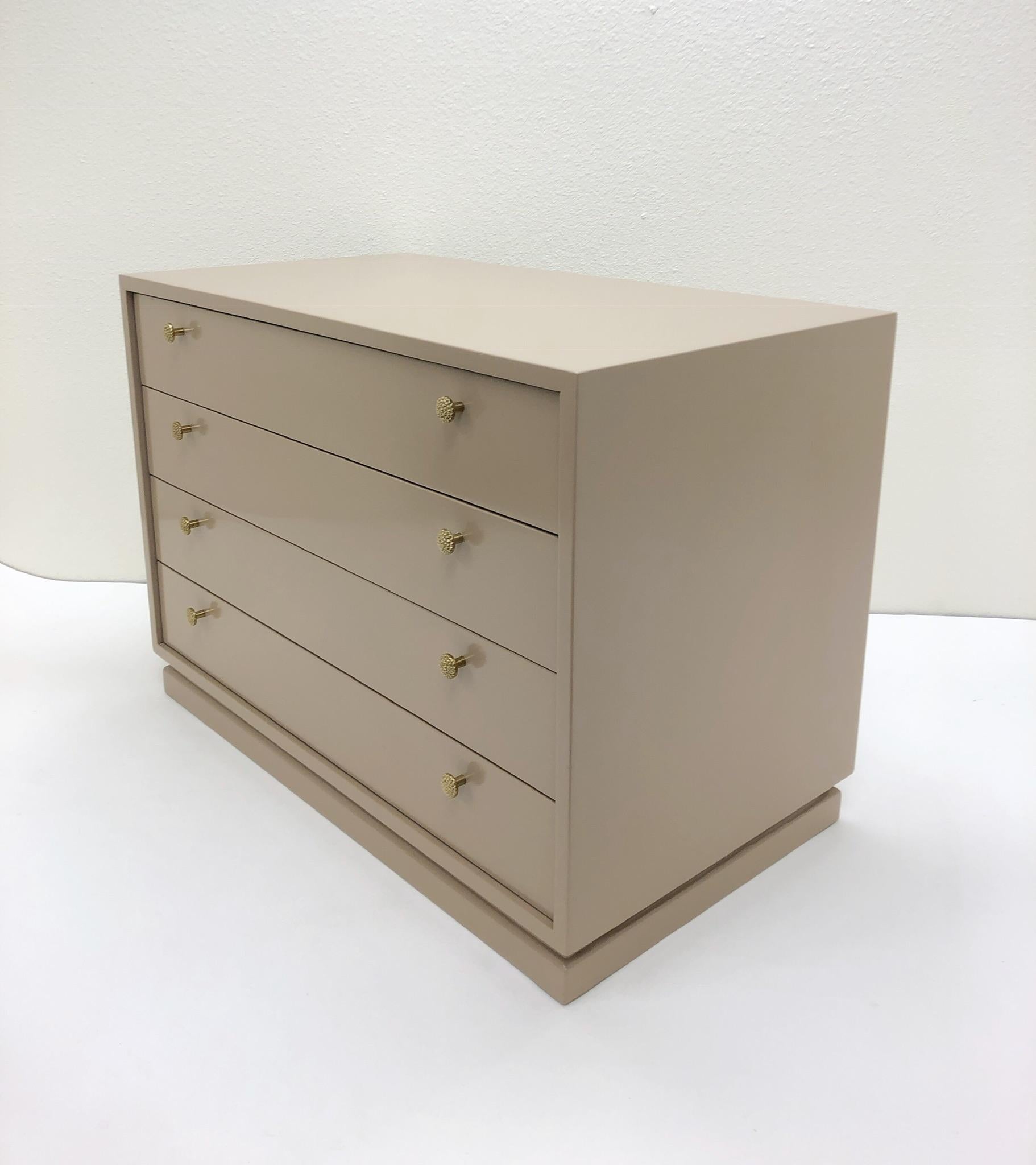 A glamorous lacquered and polished bronze four drawer nightstand design by Steve Chase in the 1980s. Newly lacquered in a light mocha brown color. 

Dimension: 34.5” wide, 19” deep, 24.5” high.