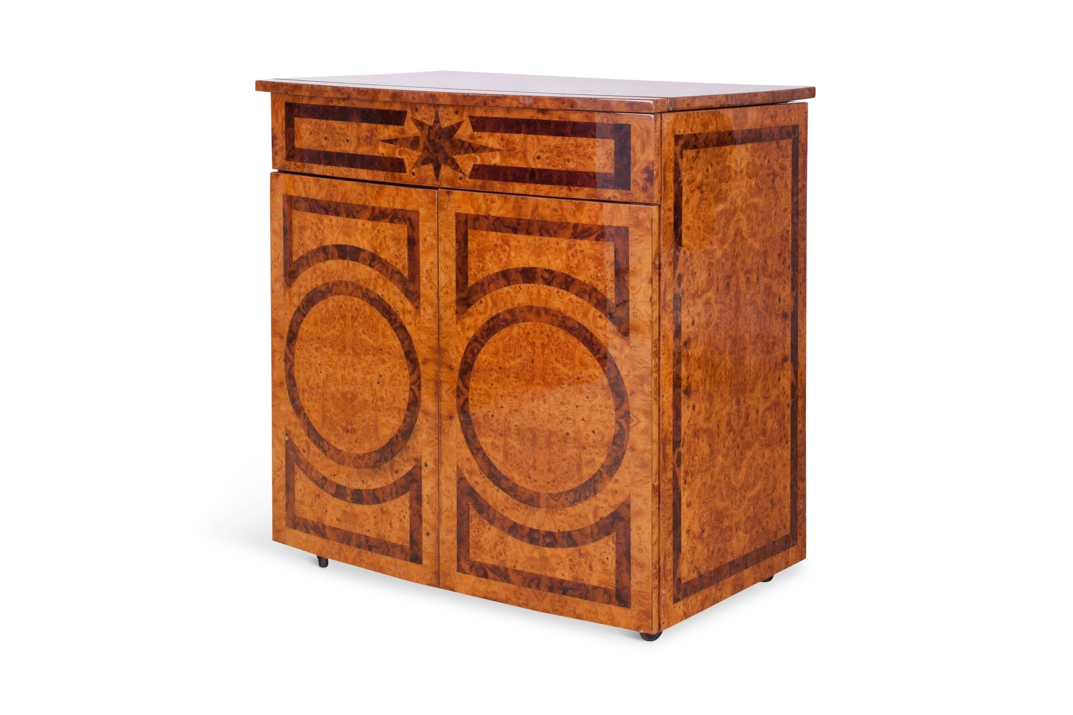 Mid-century modern dry  bar cabinet with a fantastic burl inlay exterior

A small button on the side makes the bar unit 
rise and present a large space for drinks and all attributes

Brass hinges and details complete the design

A true showpiece for