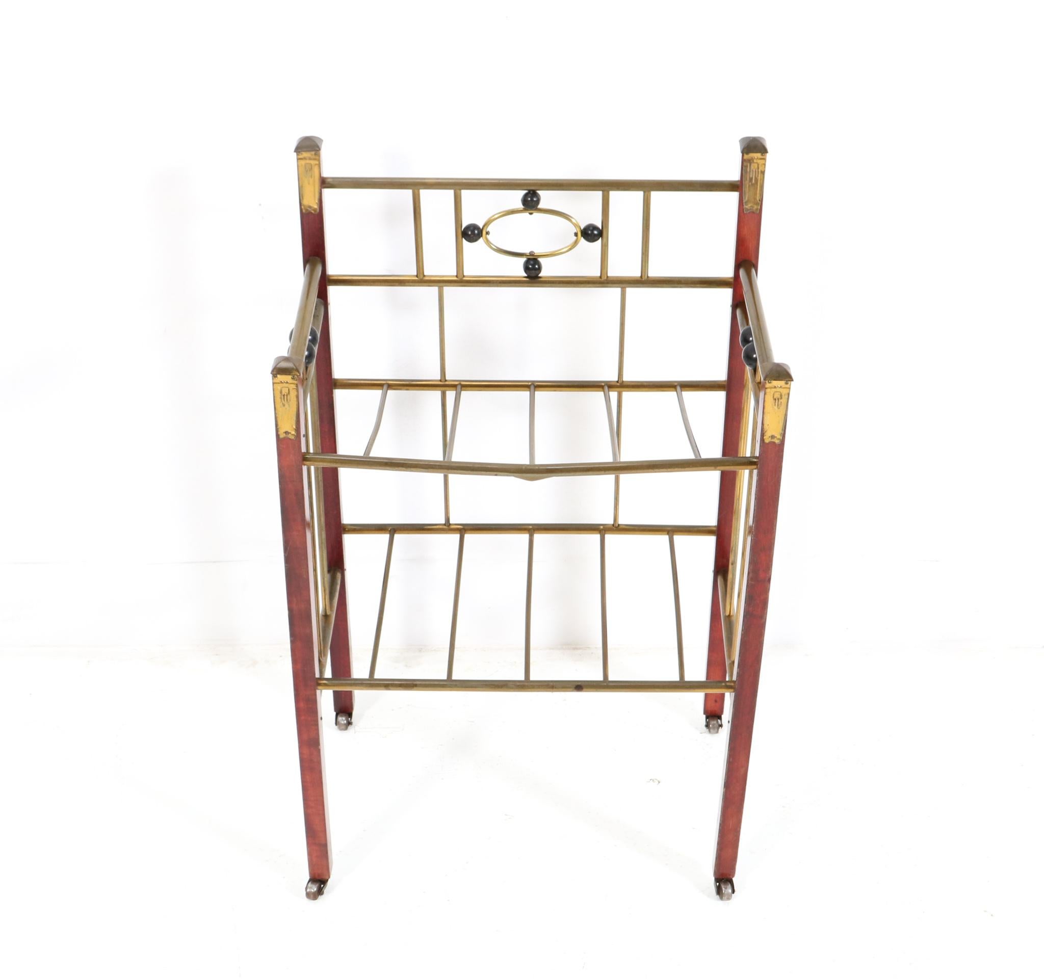 Stunning and rare Vienna Secession magazine rack or stand.
Striking Austrian design from the 1900s.
Lacquered beech and brass frame with original black lacquered elements.
This wonderful Vienna Secession magazine rack or stand is in very good